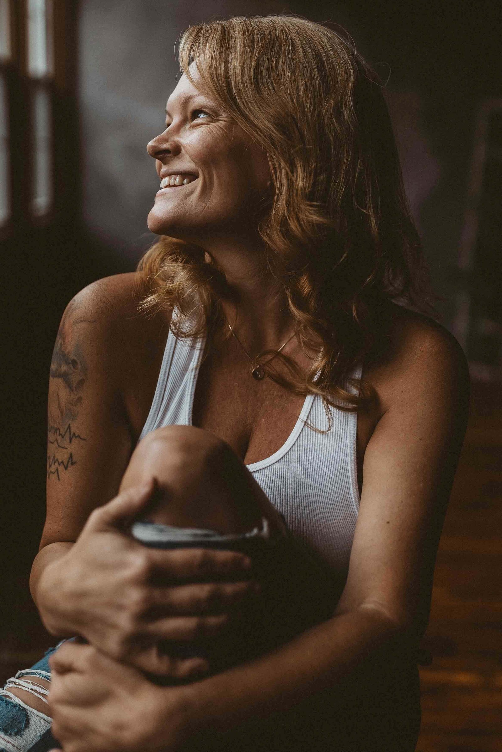 photo of a woman sitting on the floor