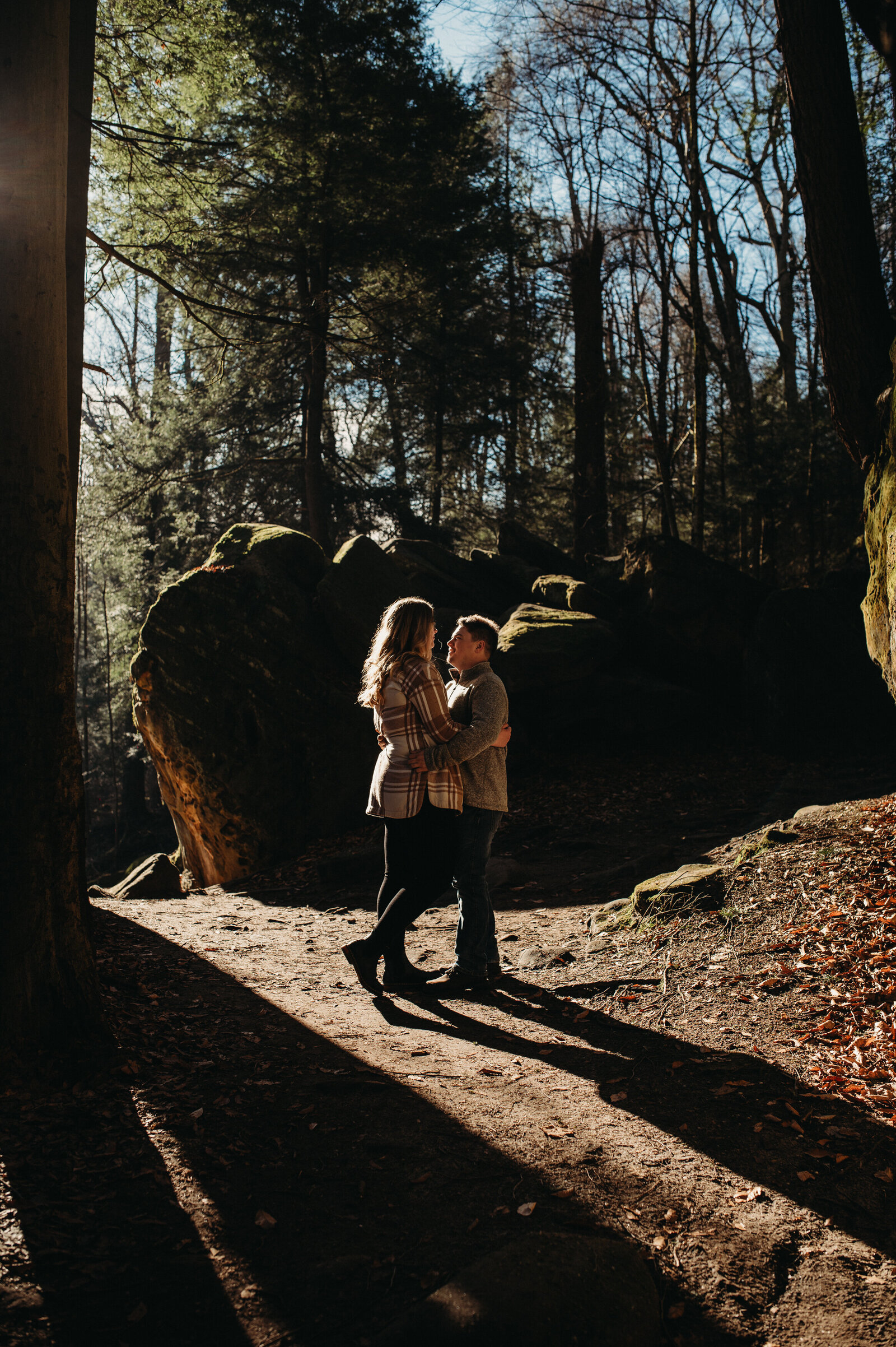 Engaged couple holds each other in a unique spot in cuyahoga valley national park