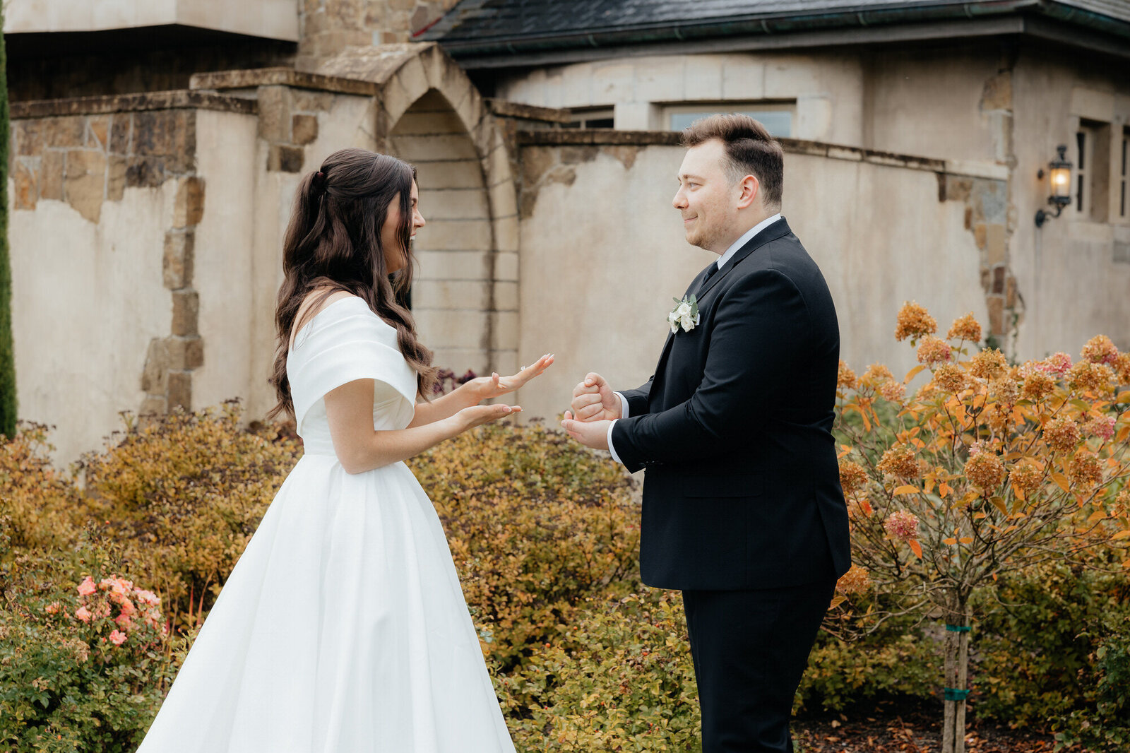 Bride and groom playing rock paper scissors at Chateau De Lis in Oregon City, Oregon