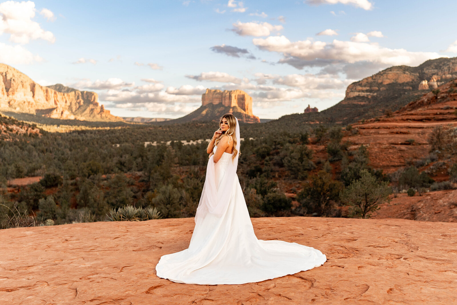 Cathedral Rock Sedona, Arizona elopement photo shoot bride standing on red rocks