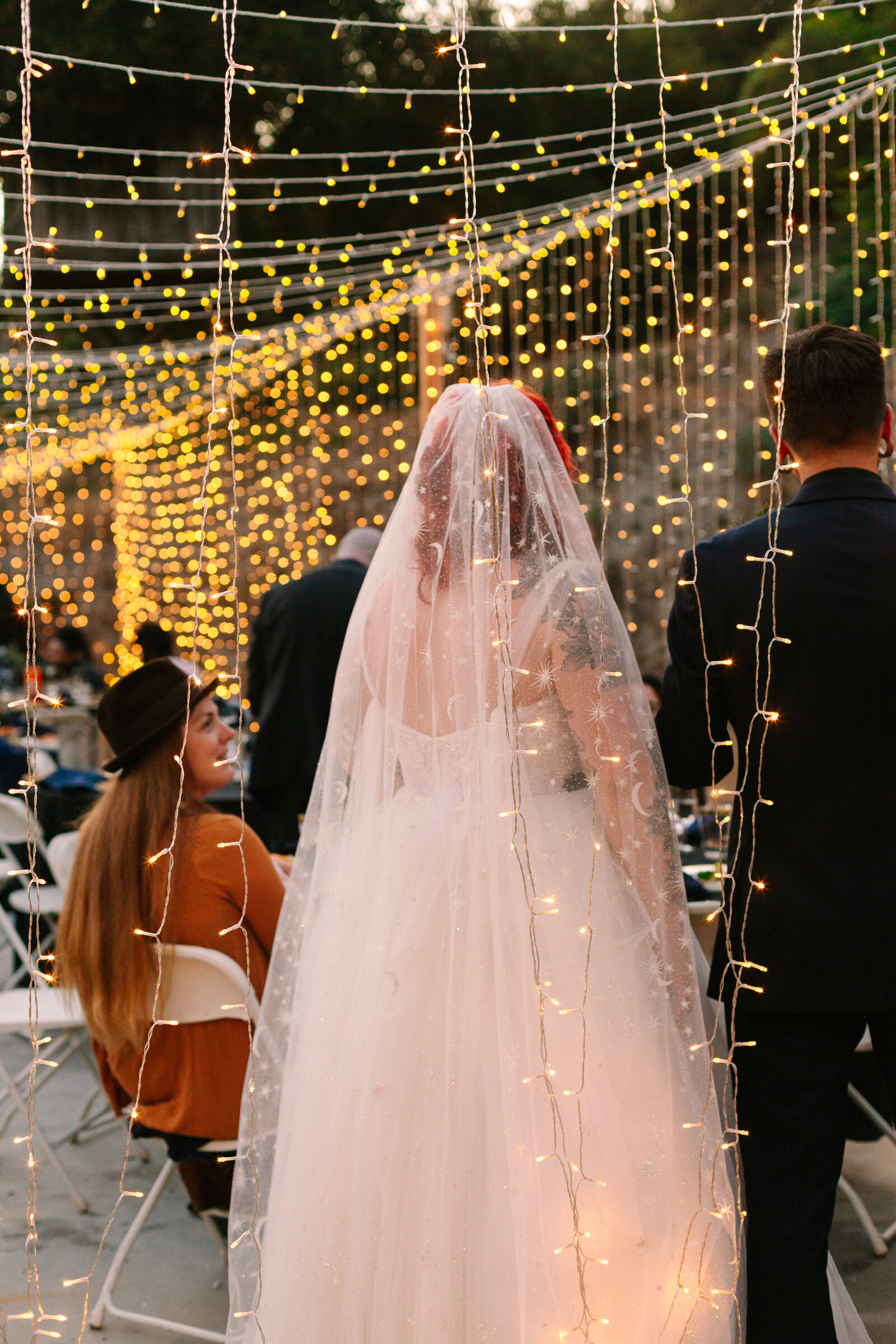 Wedding reception under string lights.