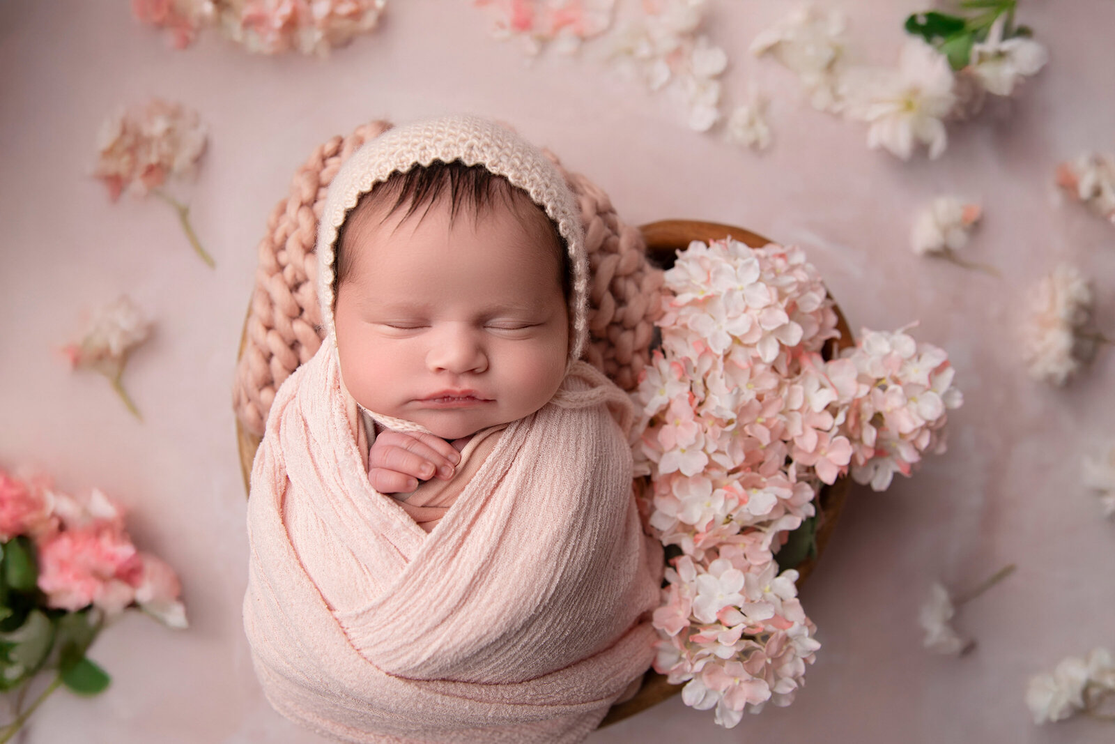 adorable newborn baby girl in pink