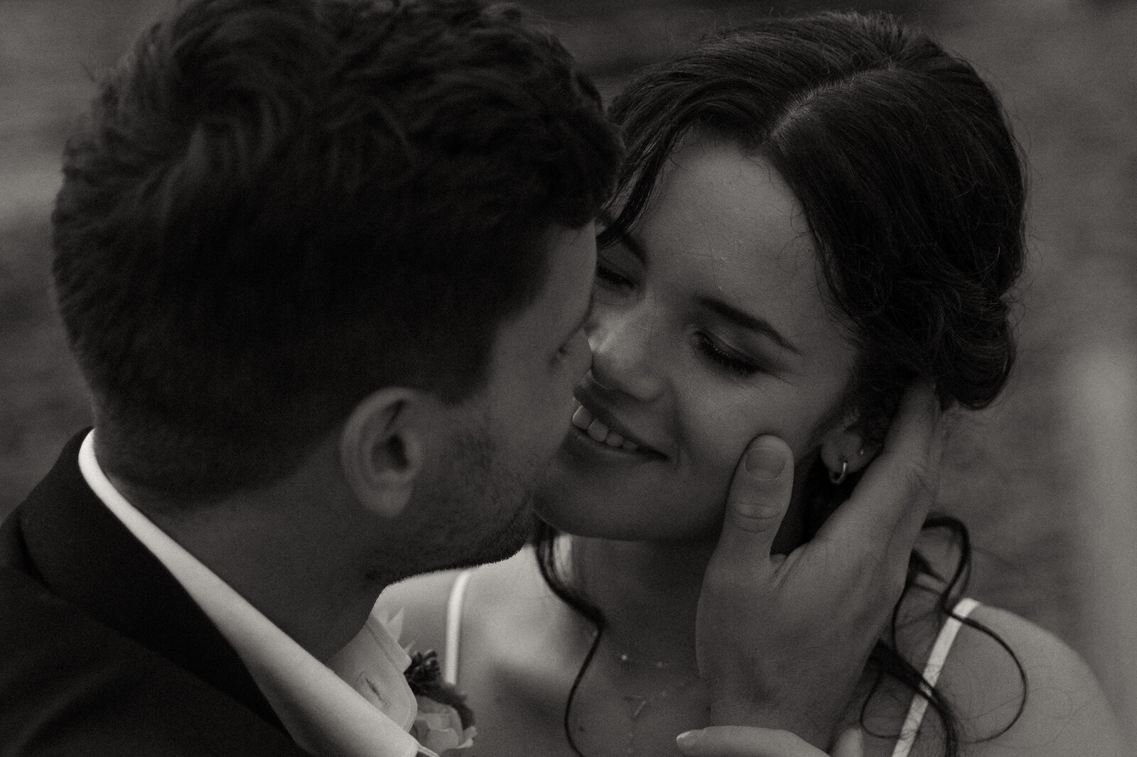 Minnesota Wedding Photography of bride and groom going in for a kiss in black and white