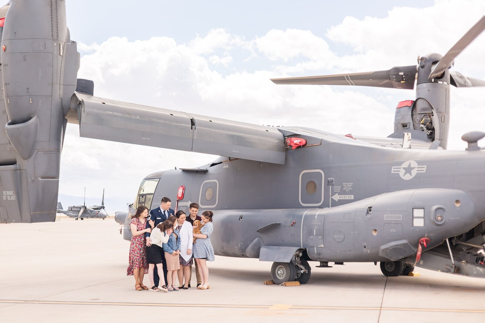 Air Force Family laughing  under a CV-22
