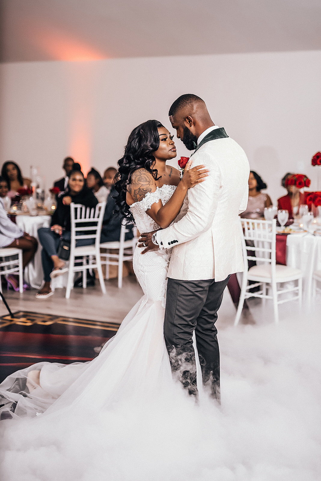 Bride and groom at their reception having their first dance