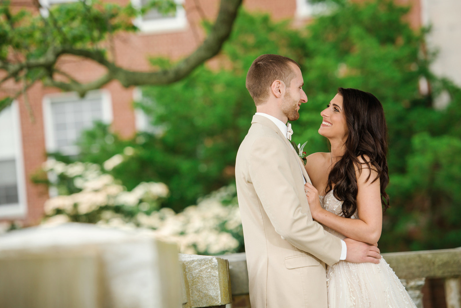 Bride and groom hugging the Bourne Mansion