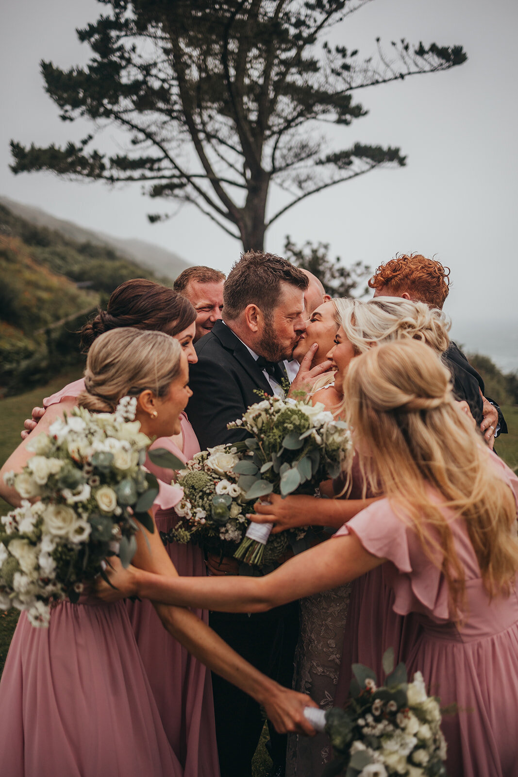 wedding party bundle together for photo