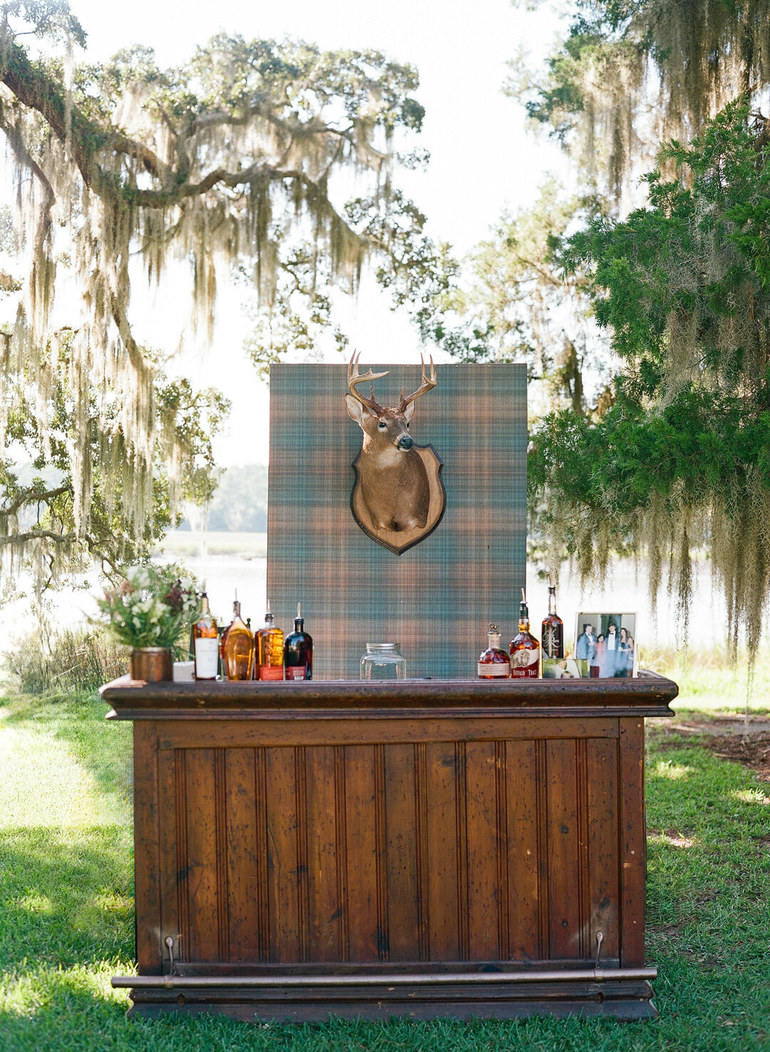 Wedding Reception Bourbon Bar with Deer Mounted behind bar