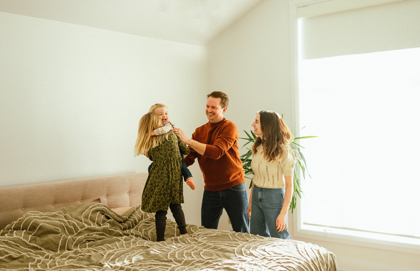 Family playing in their bedroom in the Glebe