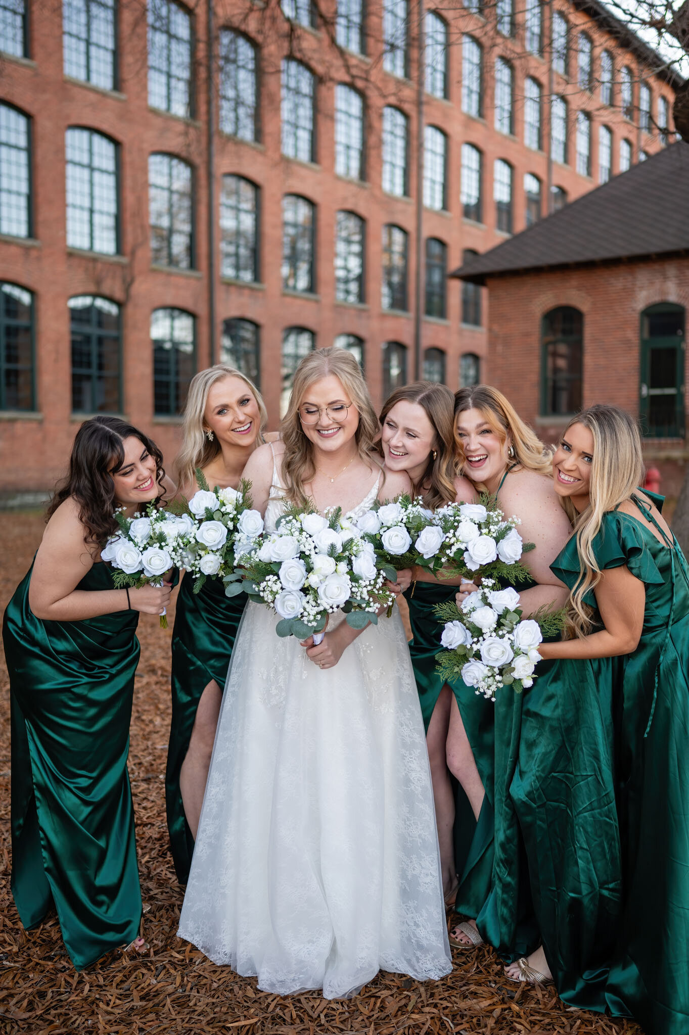 Bride with her wedding party in green dresses