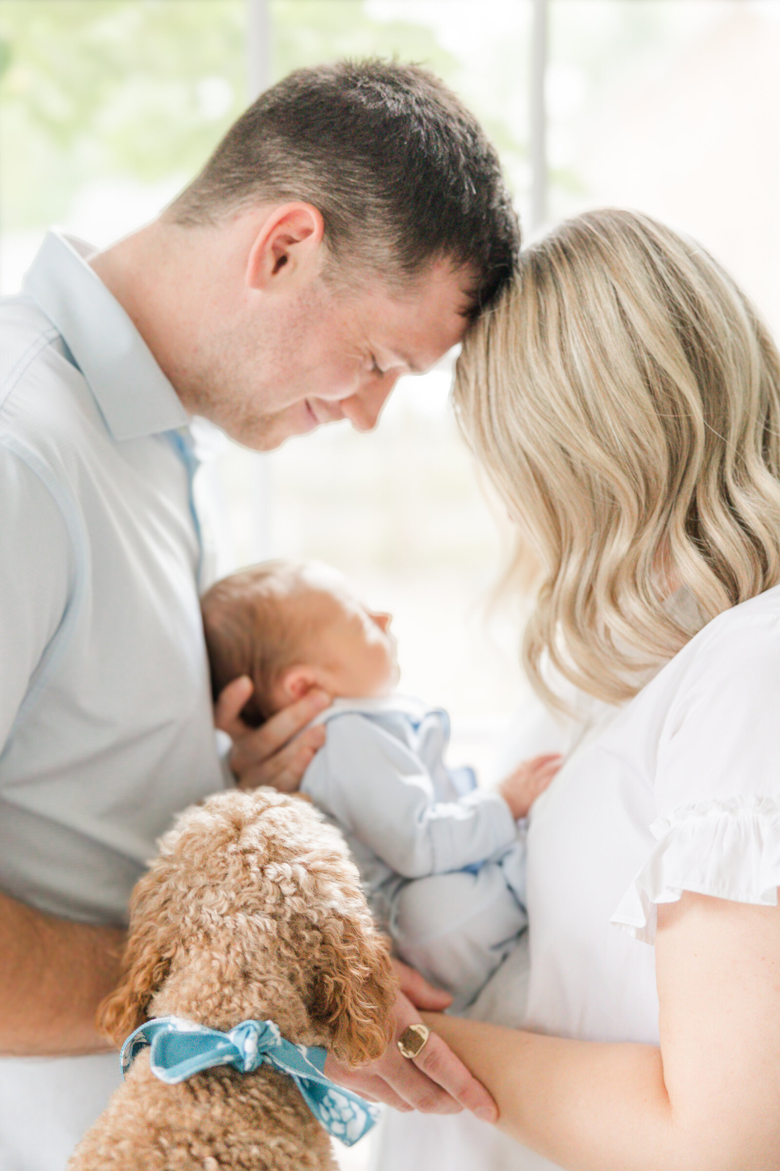 Cleveland Newborn Photographer light and airy mom and dad with dog and baby