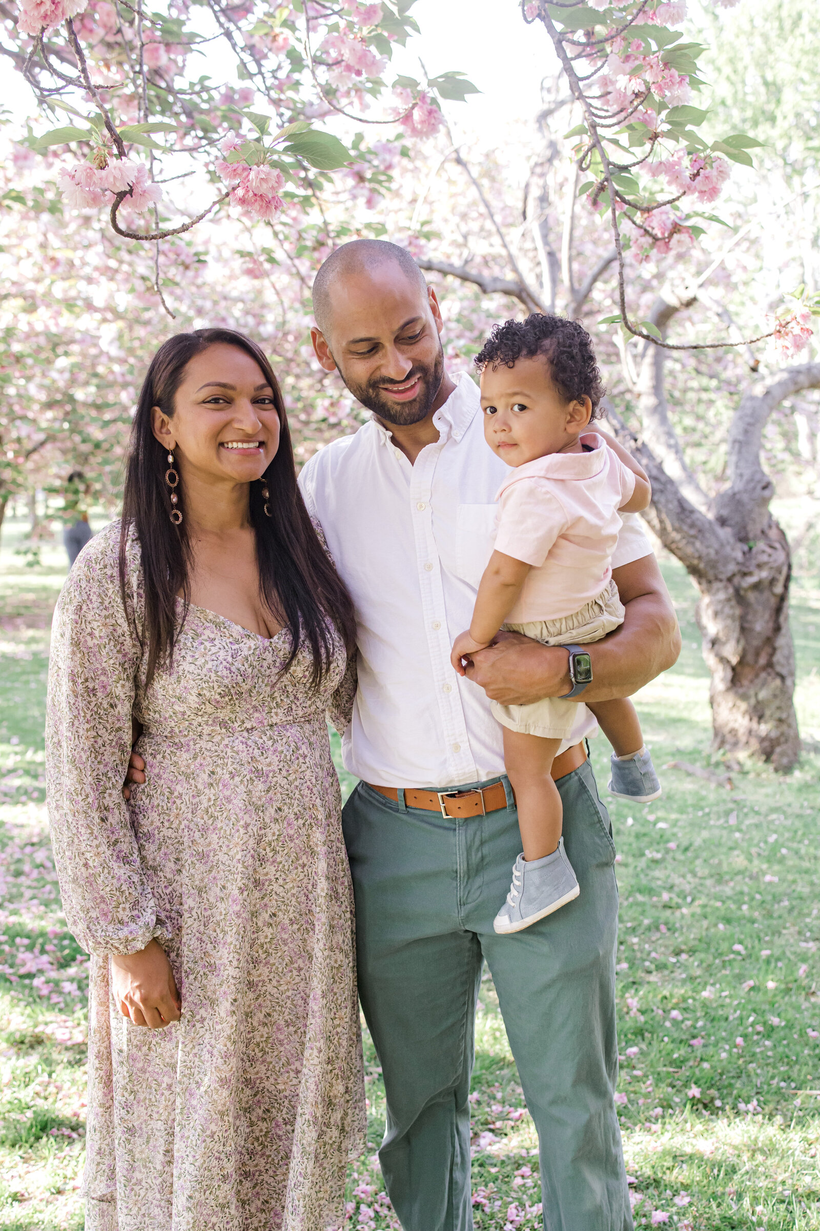 Family photo under cherry blossom tree