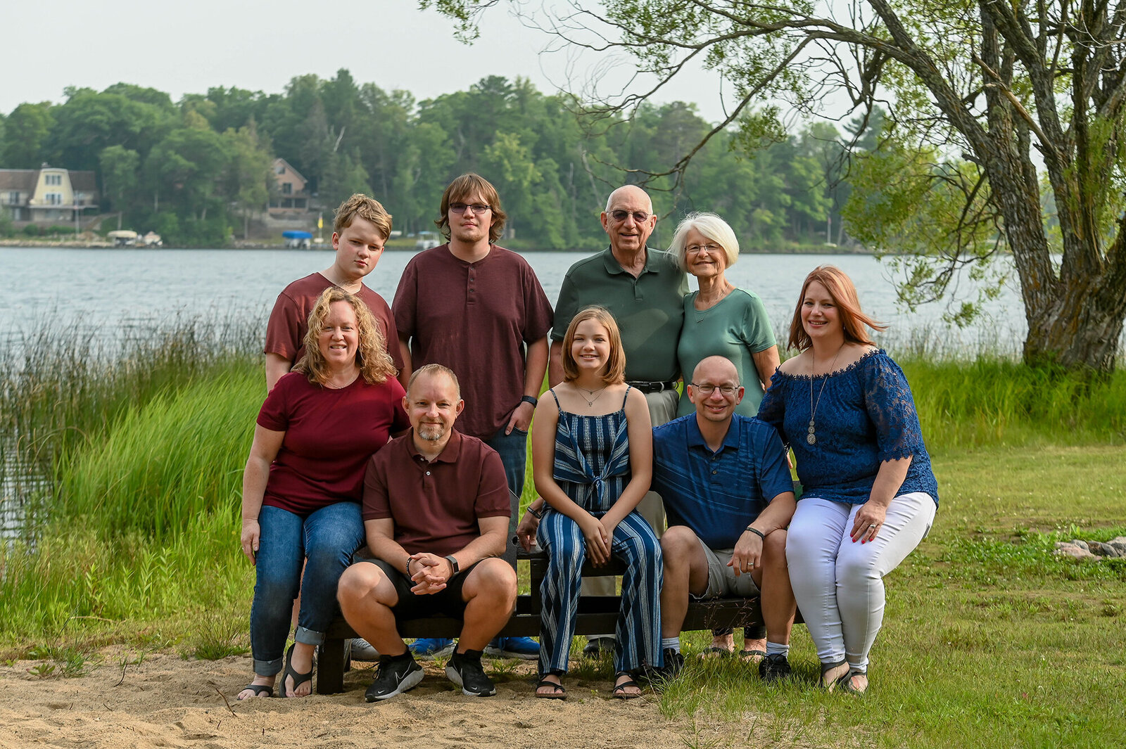 This family gathers around a picnic table to take photos