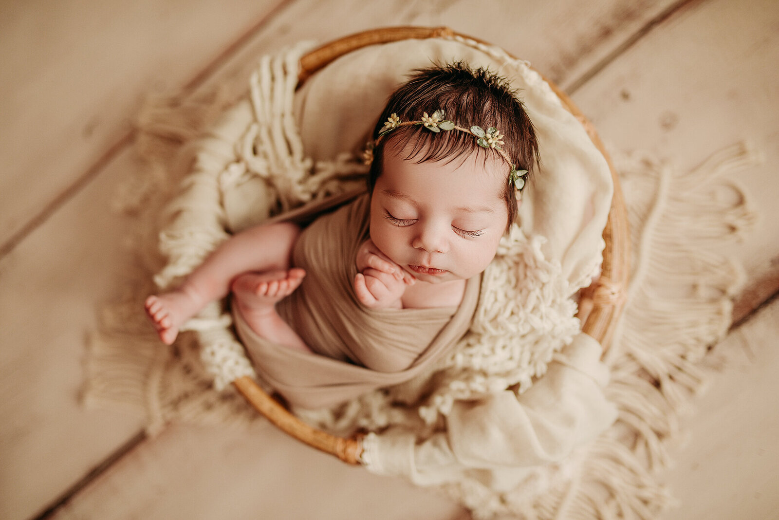 baby wrapped in a newborn photography pose