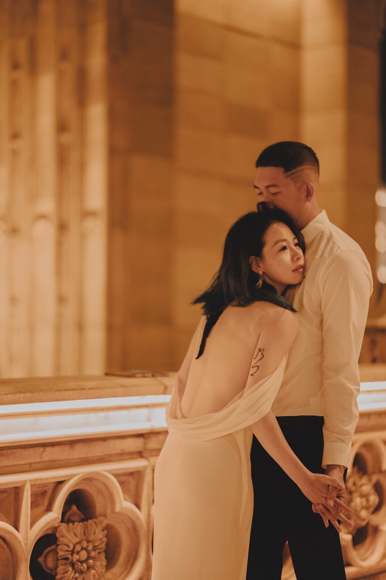 Tracy & Prescott photographed in an embrace in Macau.