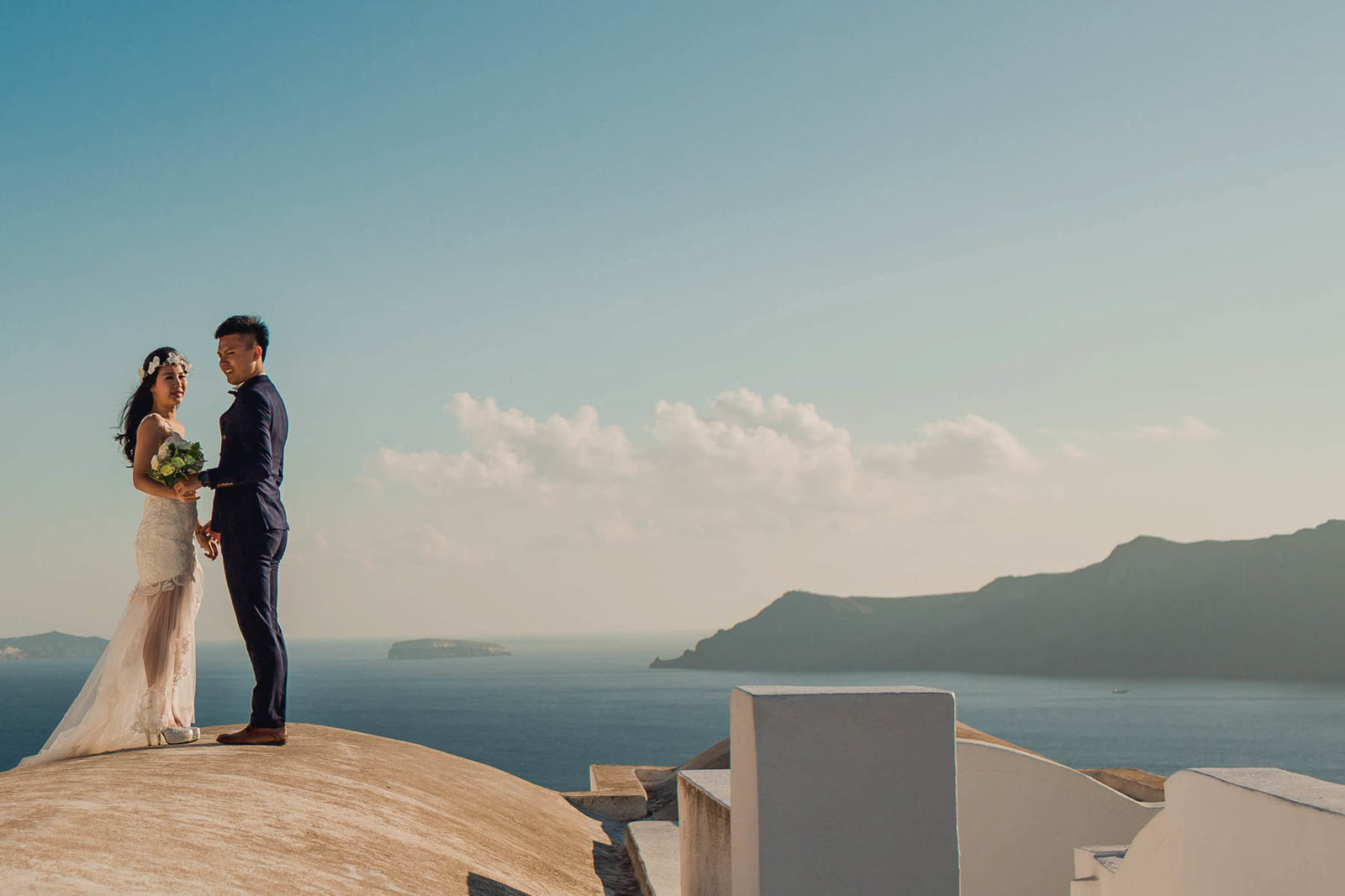 Bride and Groom on rooftop, Santorini Island, Greece