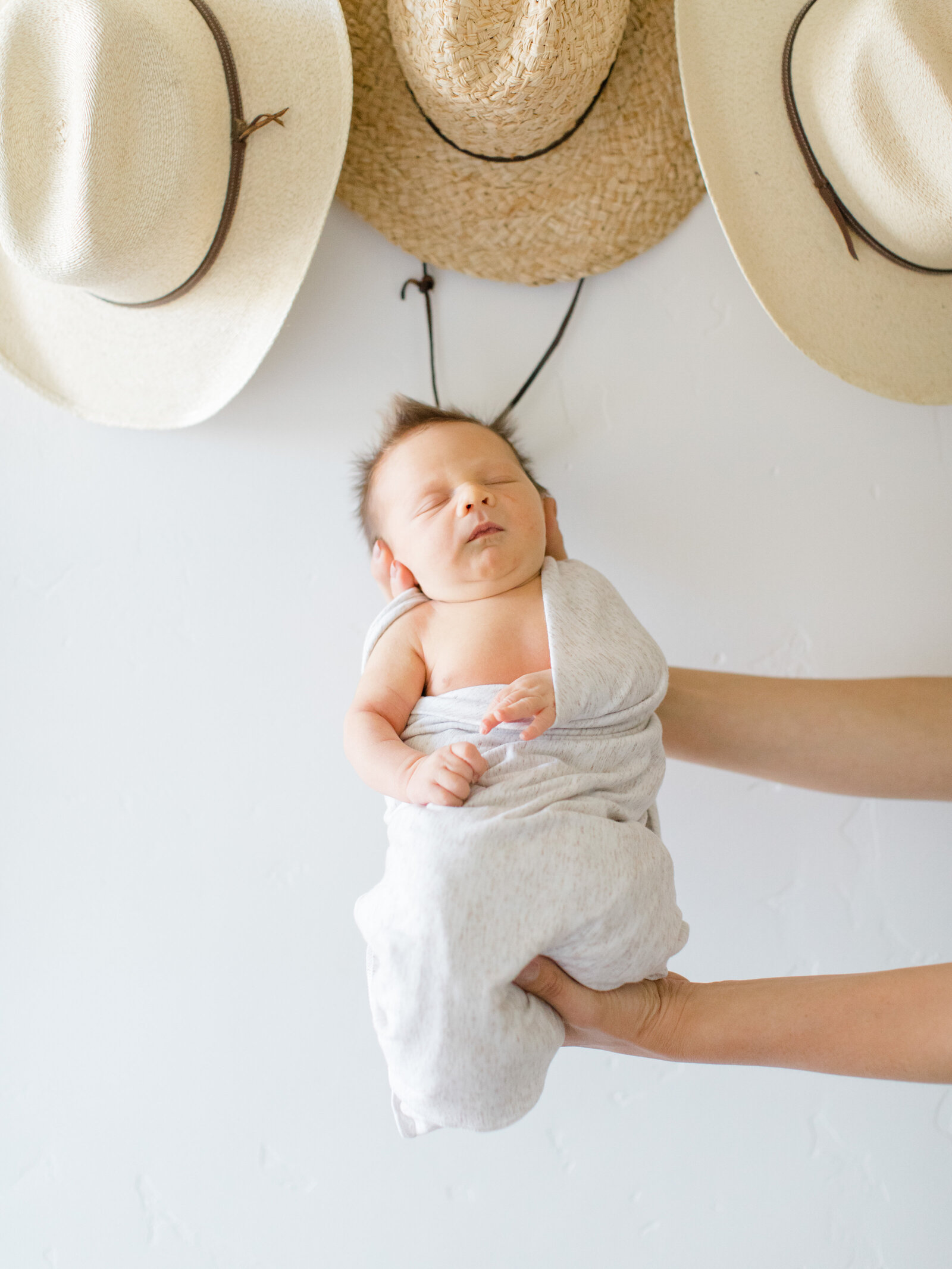 newborn baby with cowboy hats