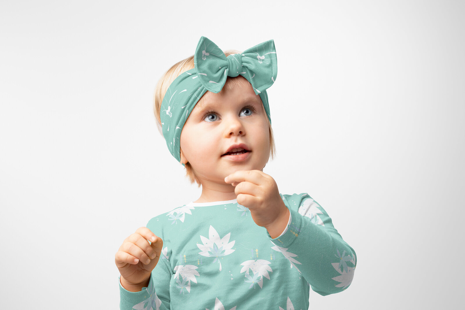 green and white patterned fabric headband and children's shirt
