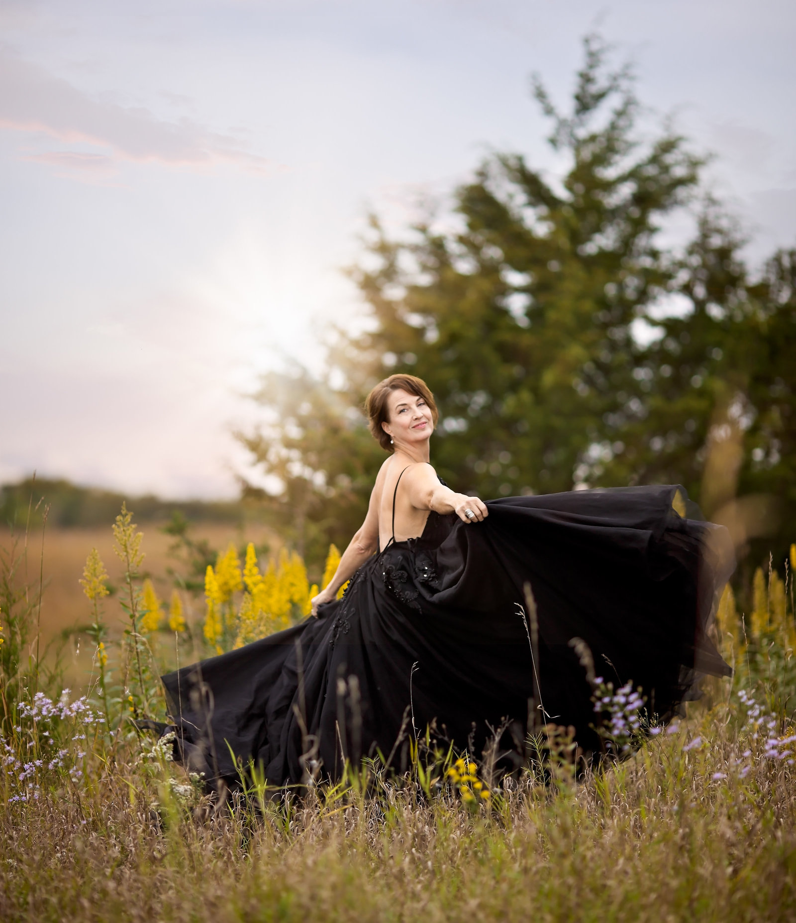 Savannah Boudoir Photography and Glamour showcases gorgeous older brunette woman in black designer gown in field