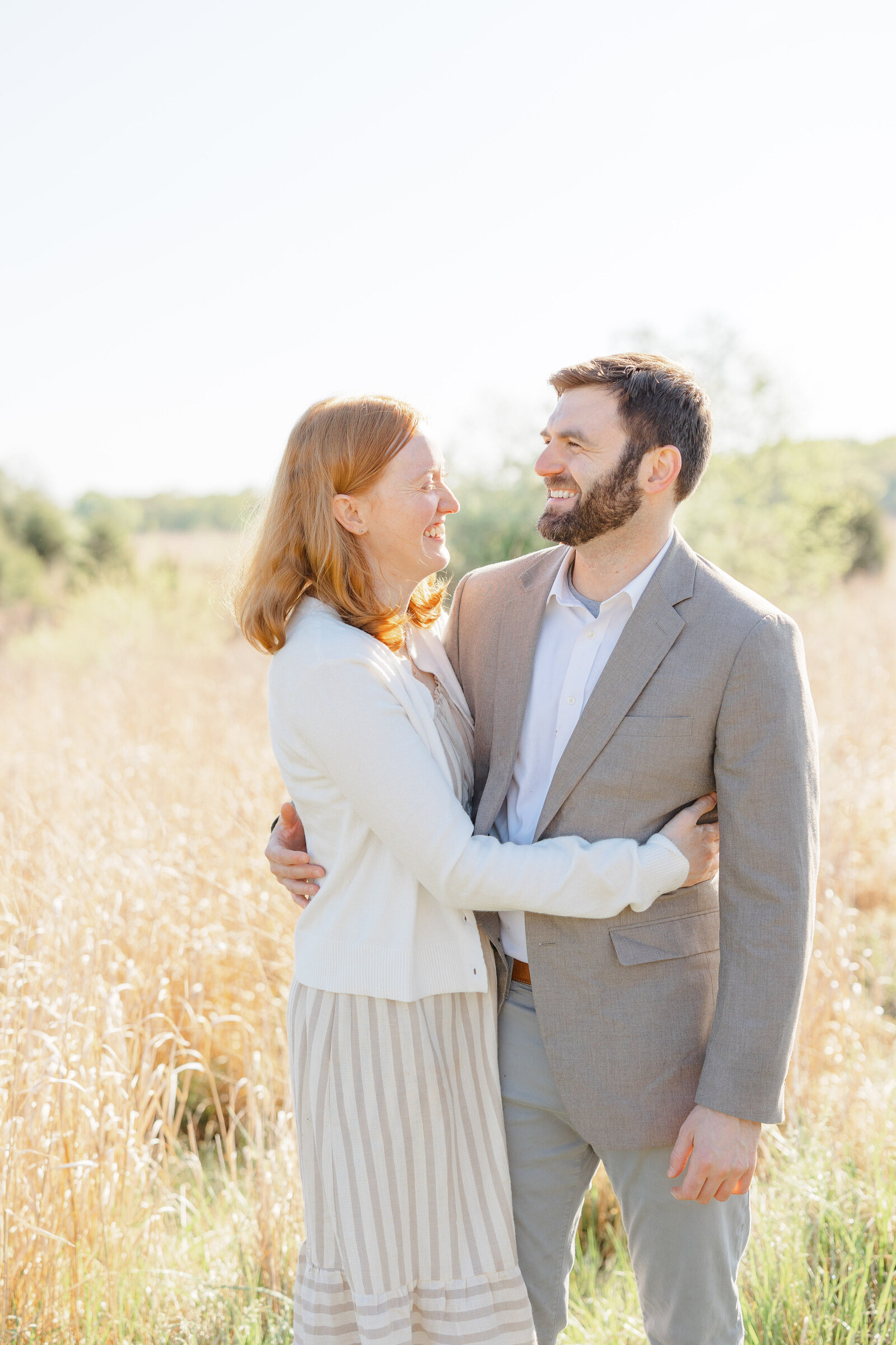 parents laughing during family photo in Warrenton, VA
