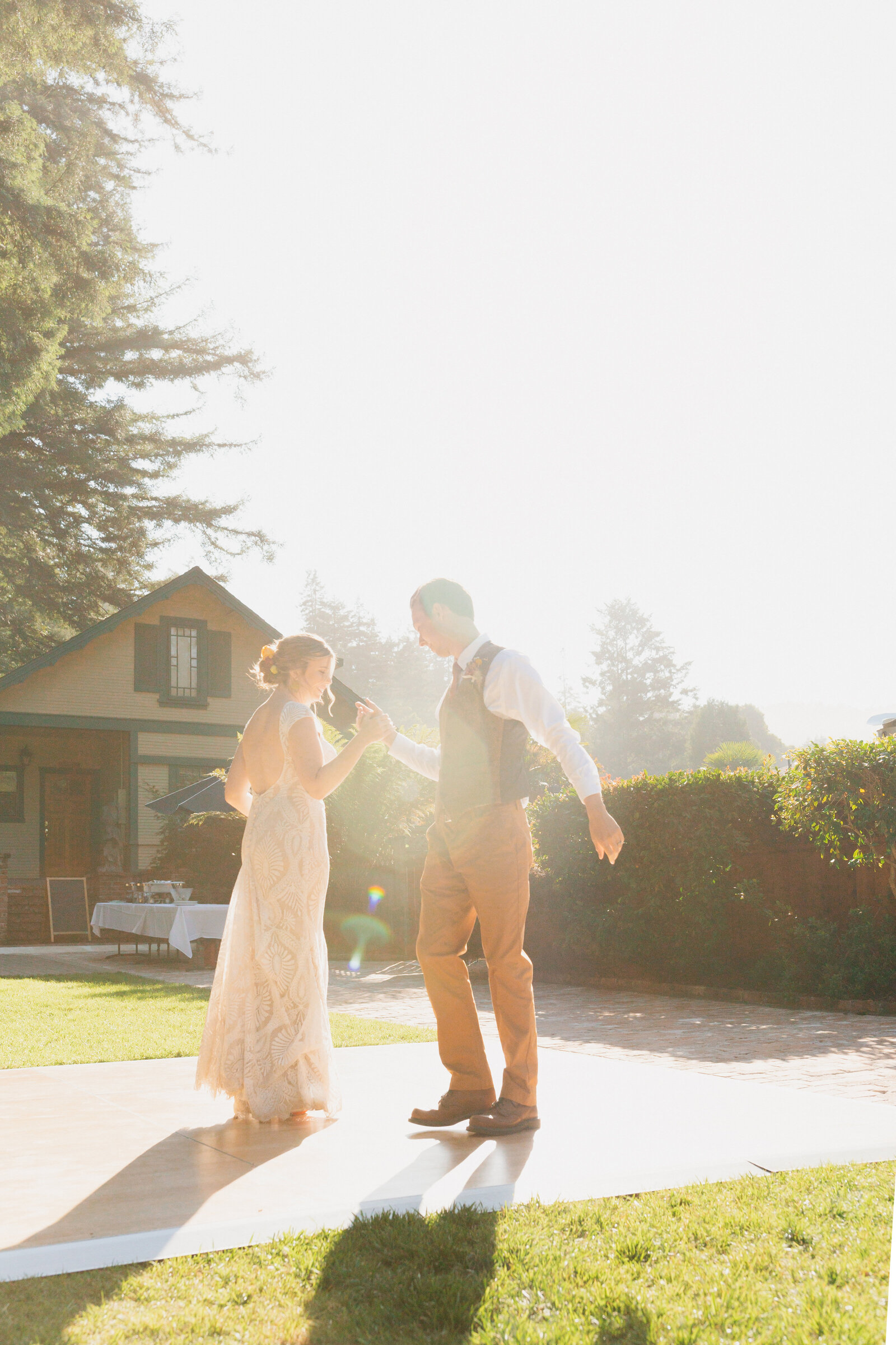 Bride and groom on their colorful wedding day in Santa Cruz, California in the redwood trees.