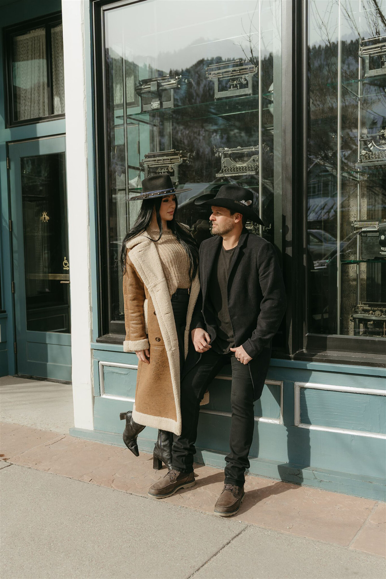 Fashion-forward winter engagement outfits in Aspen, Colorado Hotel Jerome