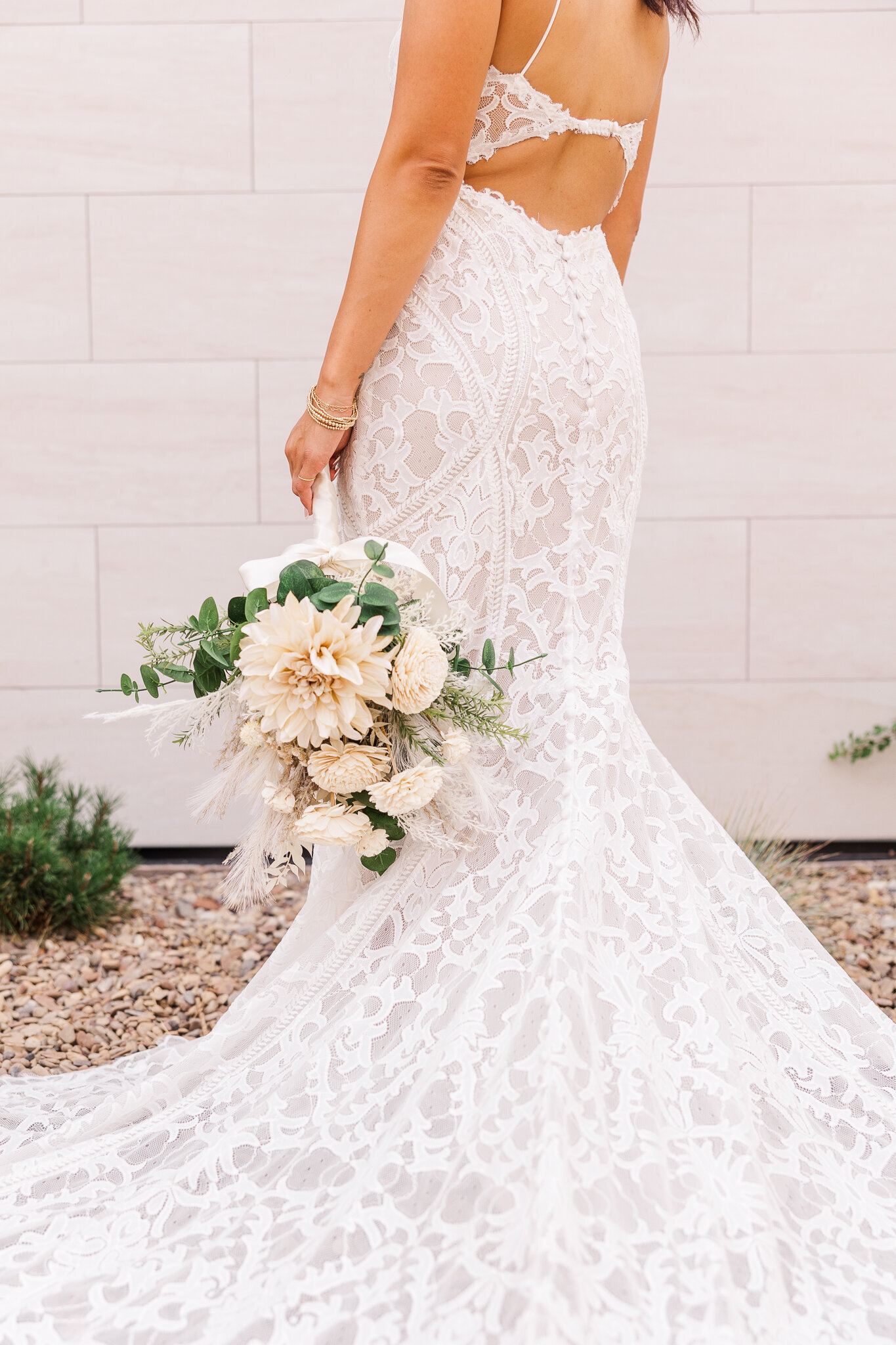 Bride's bouquet and wedding gown on wedding day in Utah
