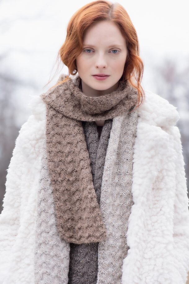 Natural makeup for a model with red hair in a white coat