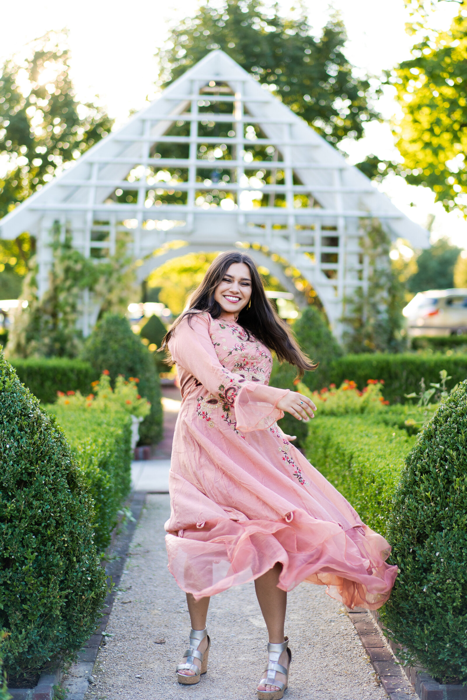 Monica, a beautiful Indian woman, tosses her dress down and laughs at the Franklin Park Conservatory in Columbus, Ohio.