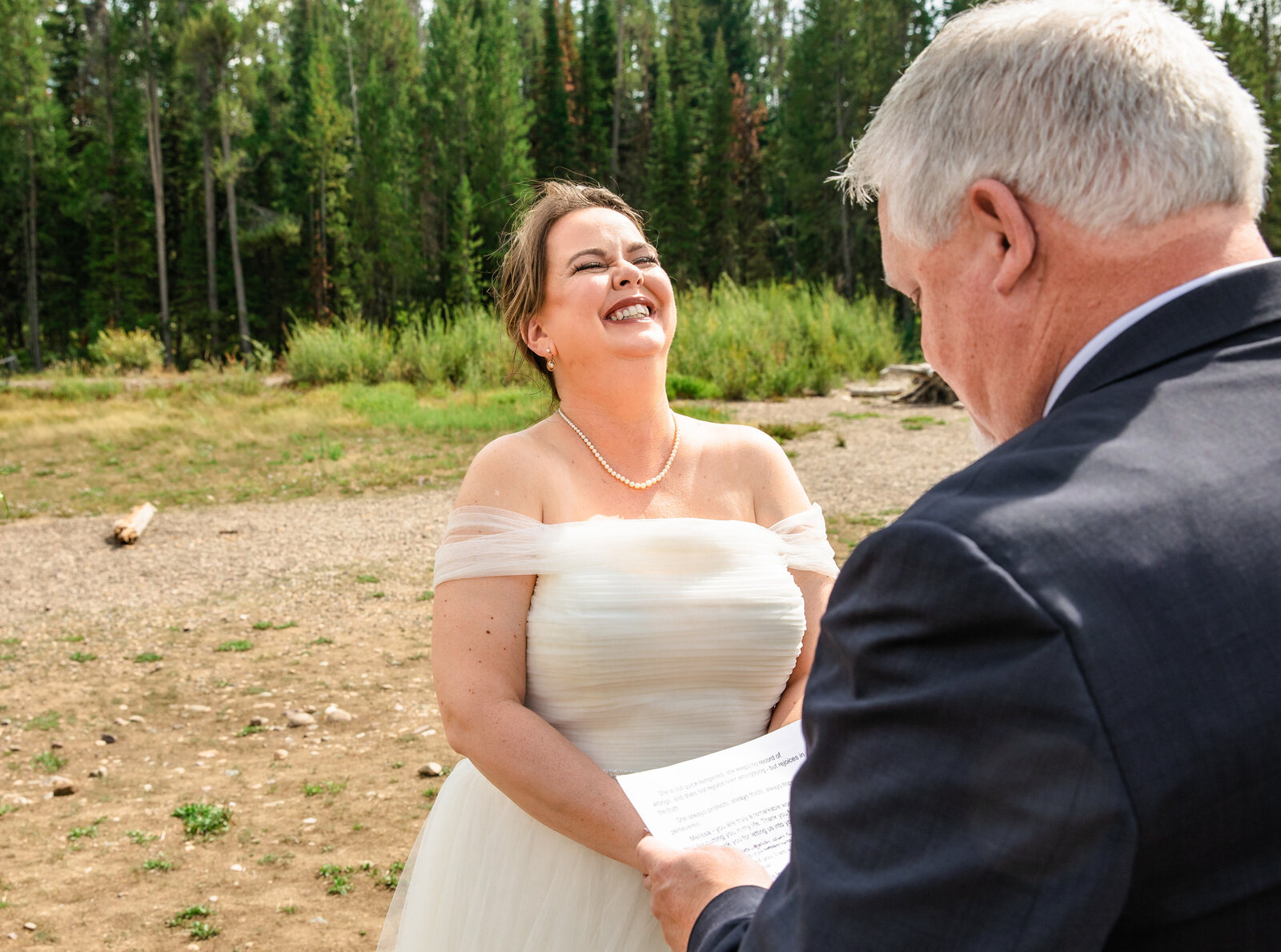 Jackson Hole photographers capture bride laughing during Grand Teton National Park wedding