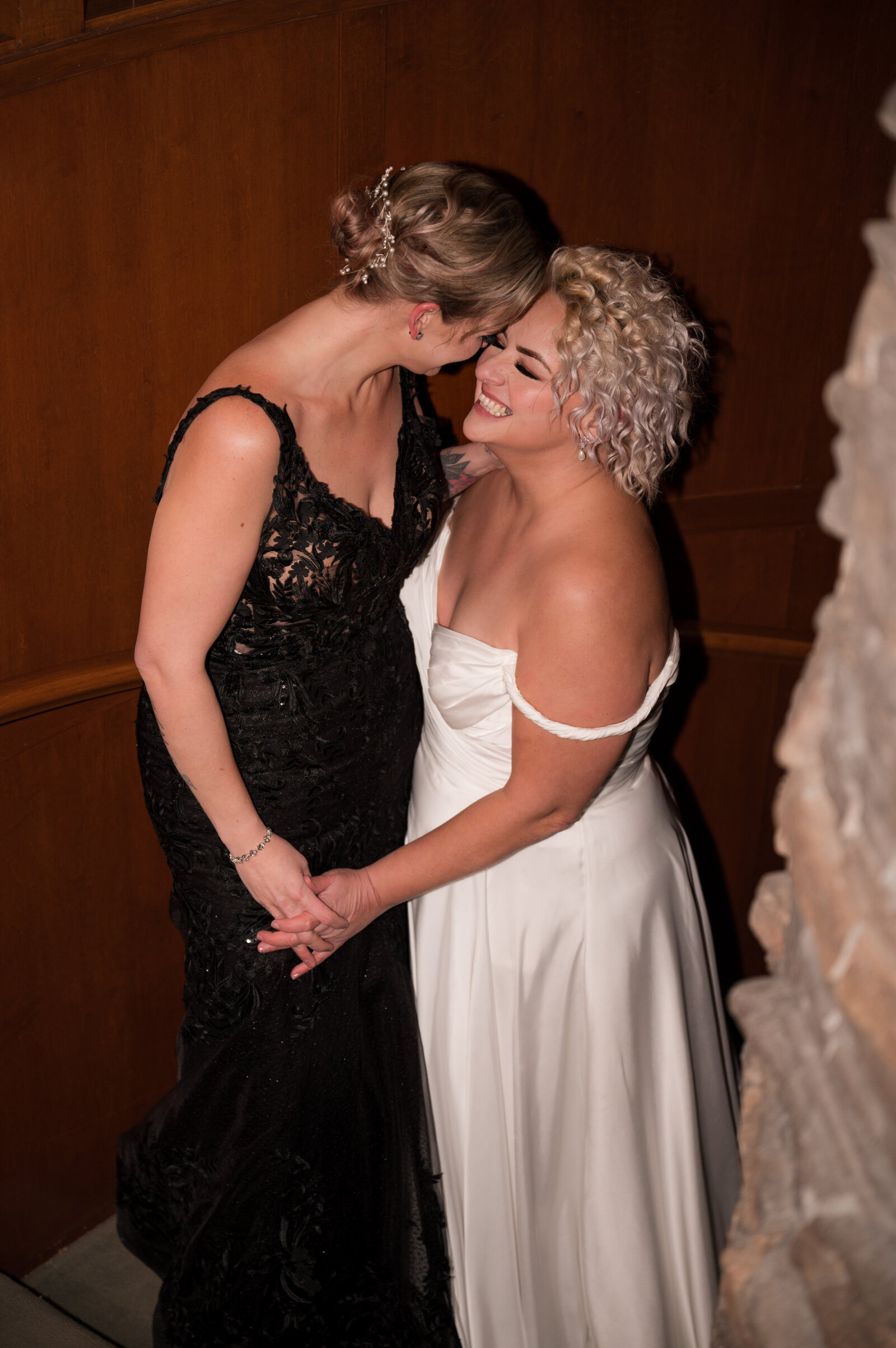 LGBTQ wedding couple holding hands by Edmonton Wedding Photographer