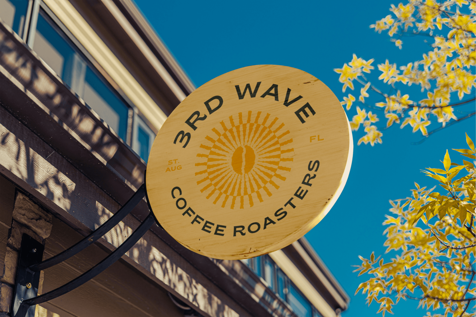 sign-mockup_3rd-wave-coffee-roasters_staugustine_wooden-circle-sign-against-blue-sky