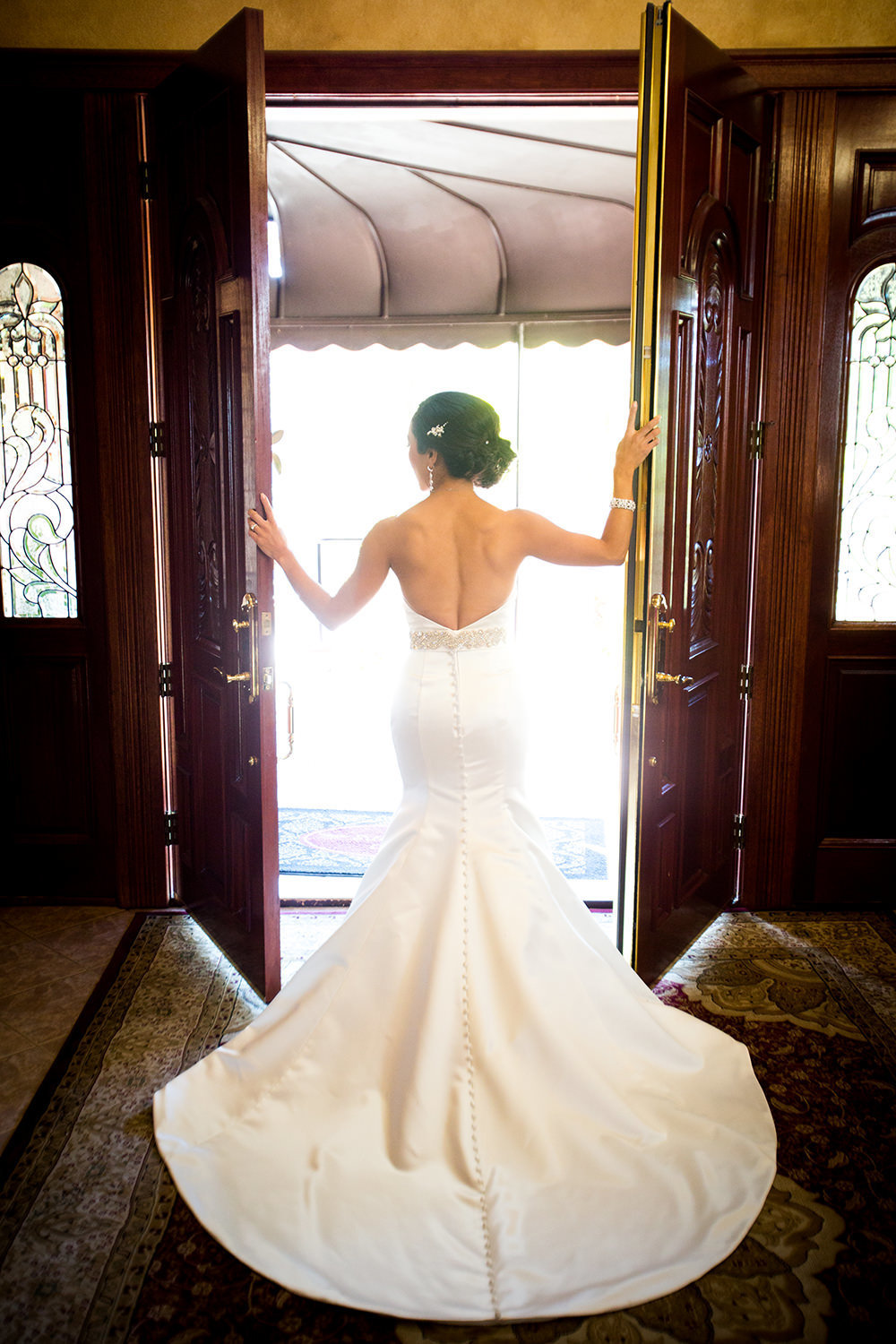 dress shot of bride looking out he doors