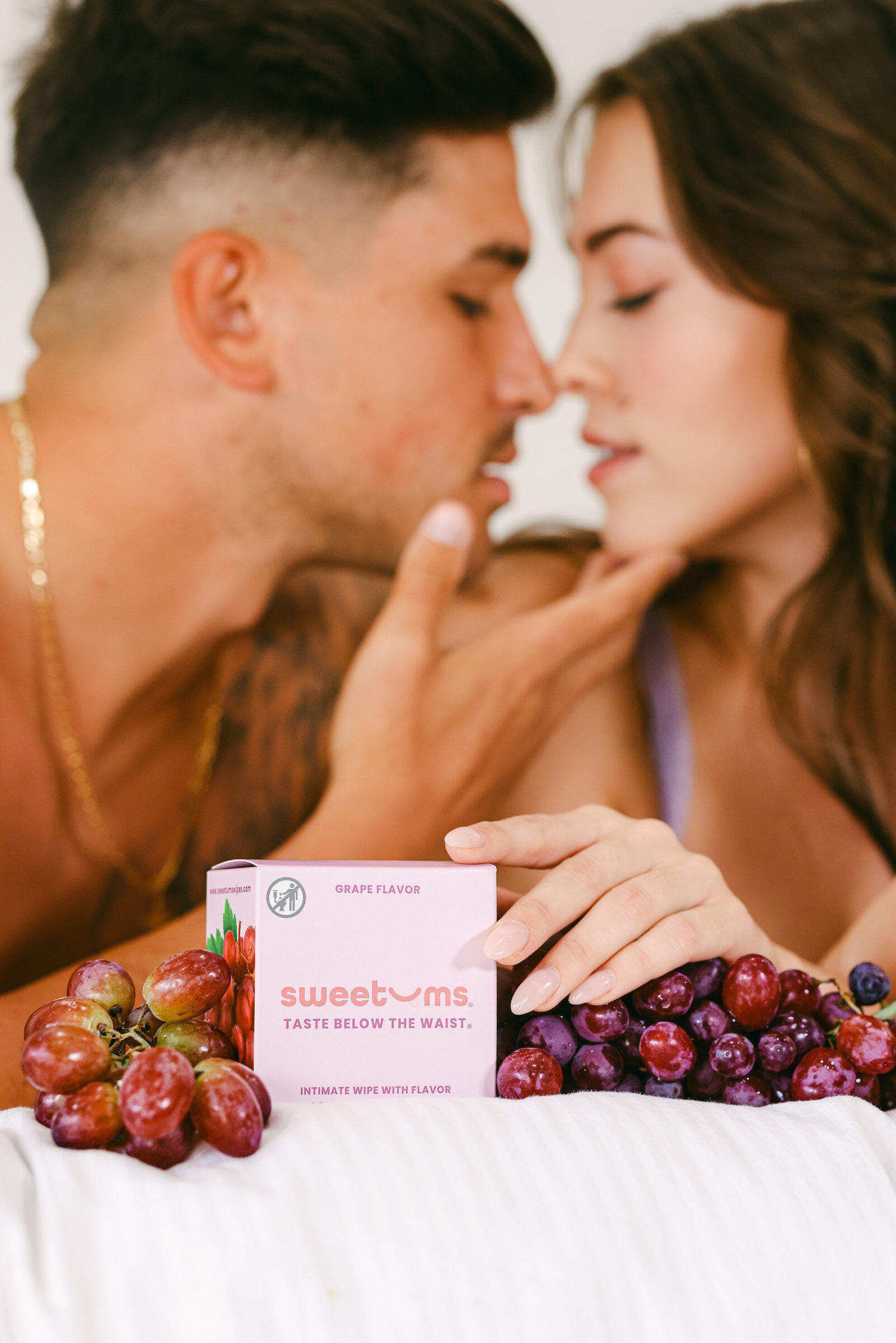 Flavored intimate wipes CPG brand lifestyle product photography with models and grapes