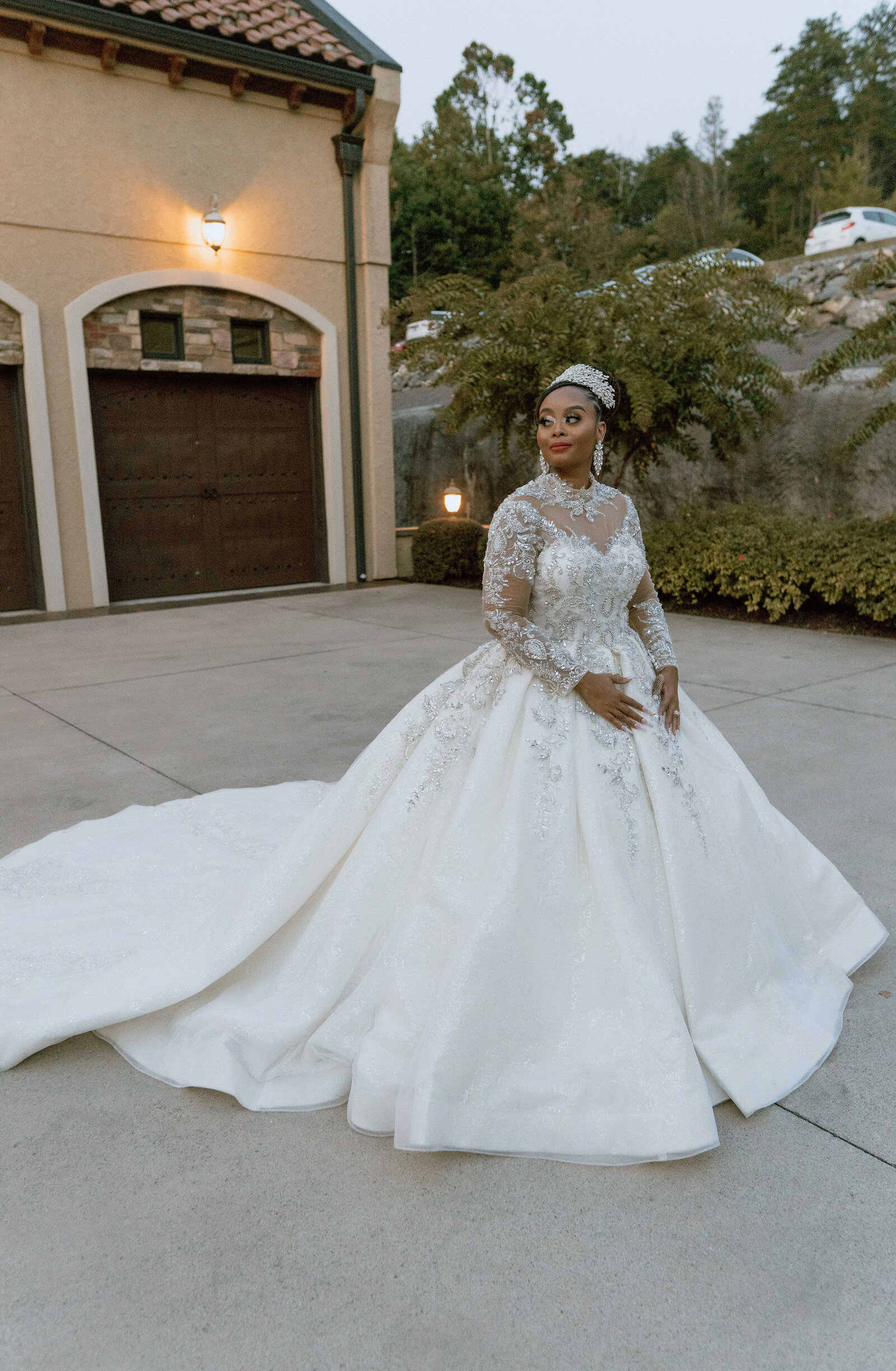 Glamorous bride showcasing a stunning wedding gown at an elegant outdoor wedding venue in Raleigh.