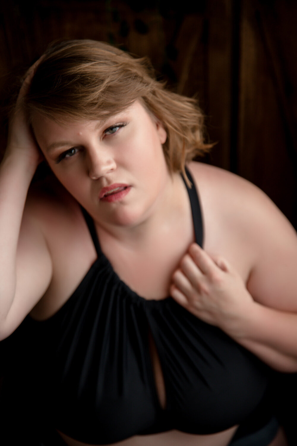 woman wearing a black top posing for a portrait session in Glencoe, Minnesota.