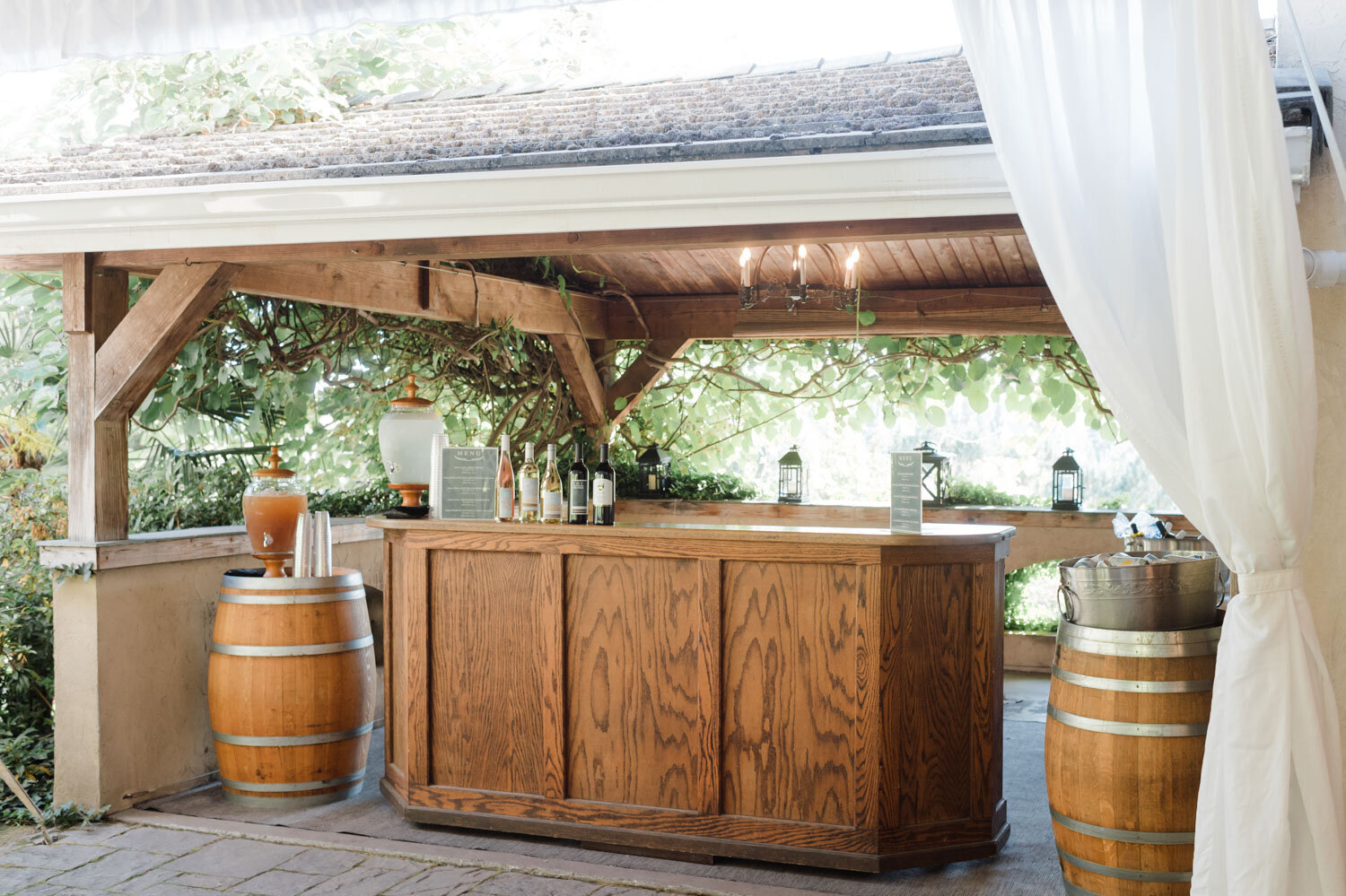 Rustic outdoor bar with wine bottles