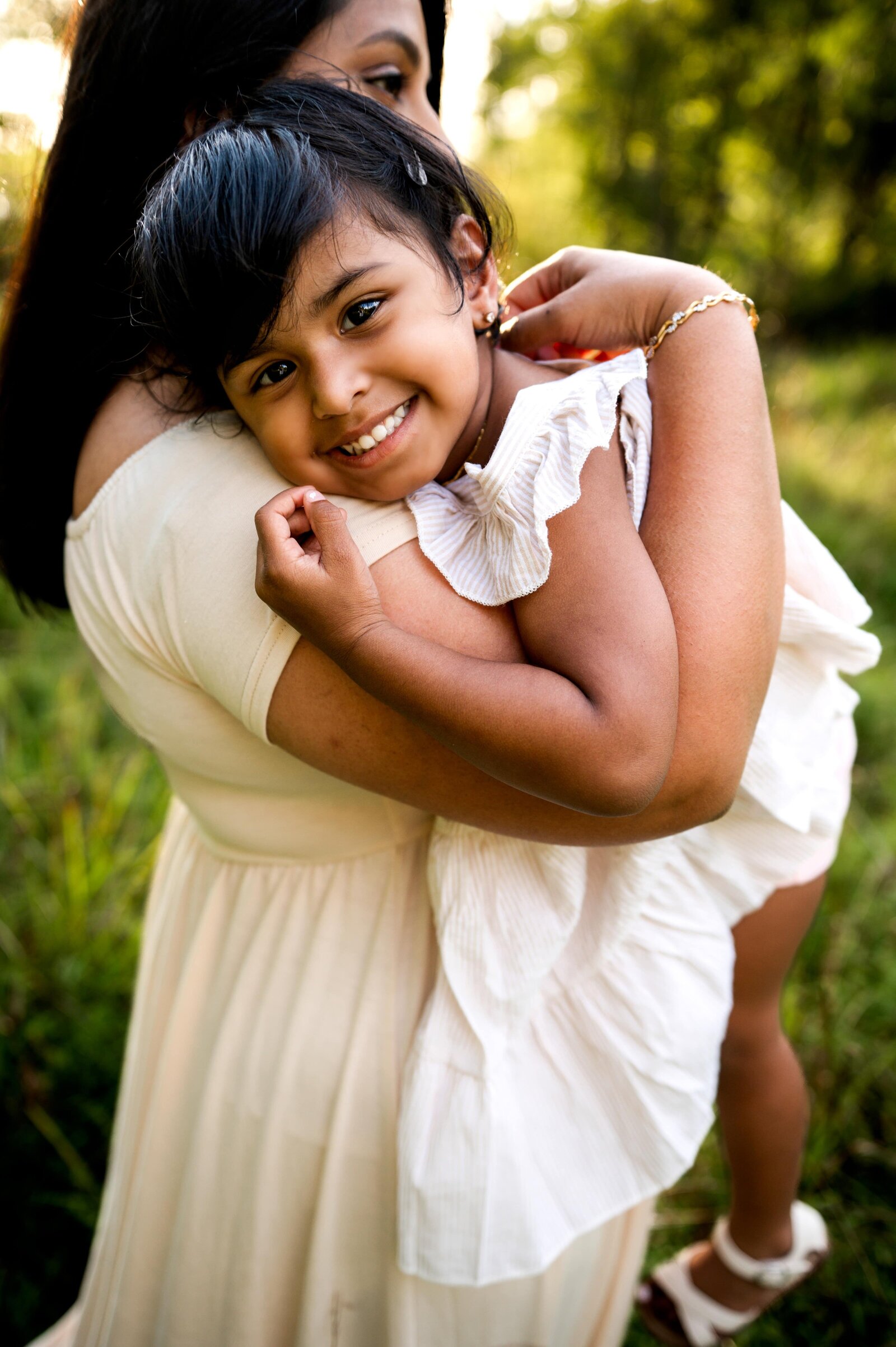 mom hugging daughter