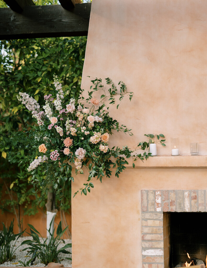 royal-palms-fireplace-floral-arrangement-winter-weddings-phoenix