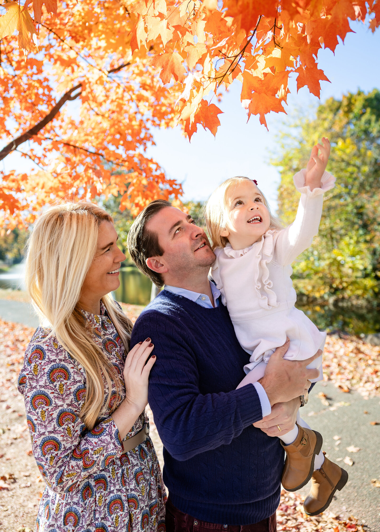 Smiling family at an Essex County, New Jersey park in the fall.