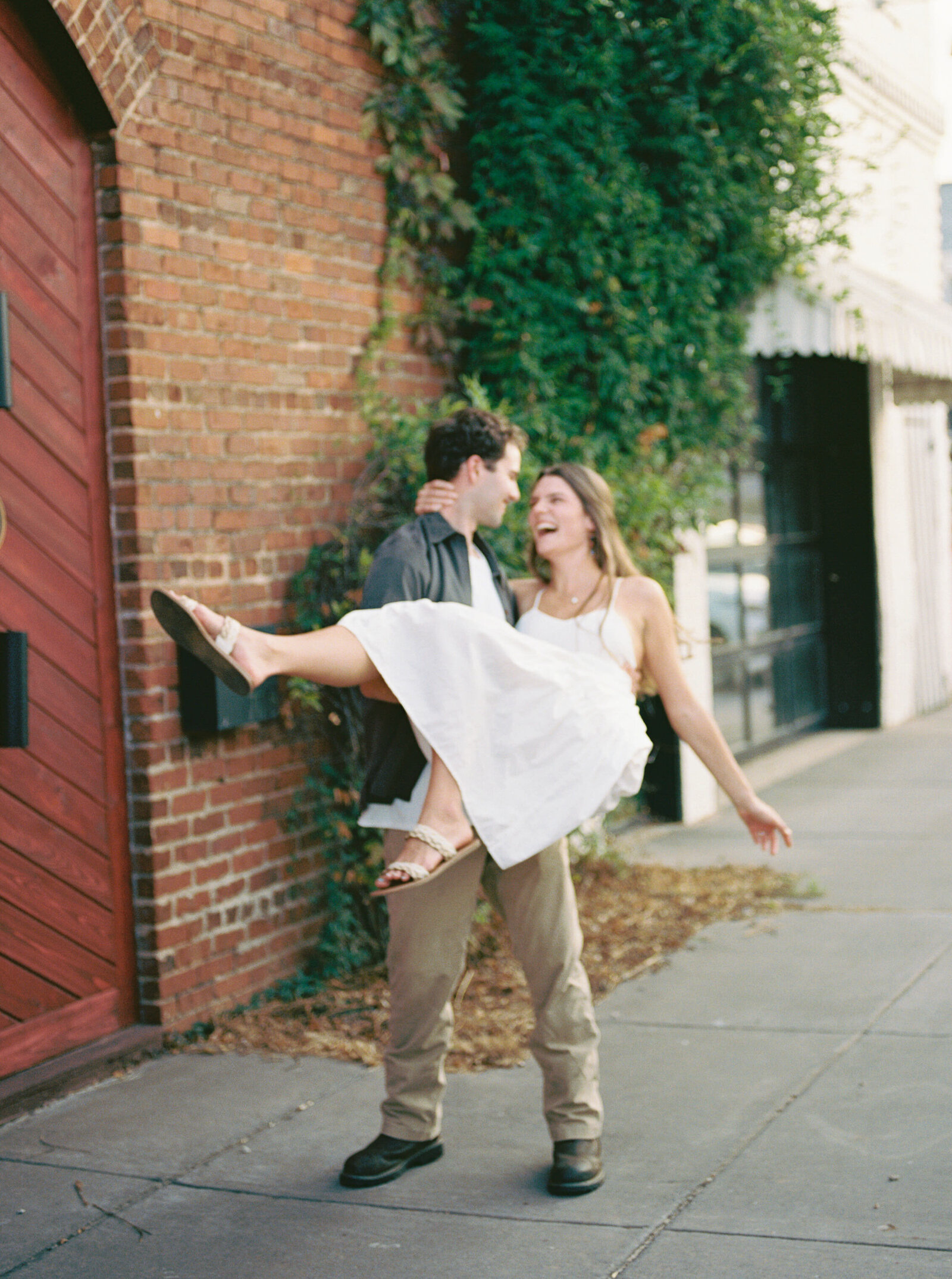 Urban engagement photographer Alabama downtown city outdoor natural light.