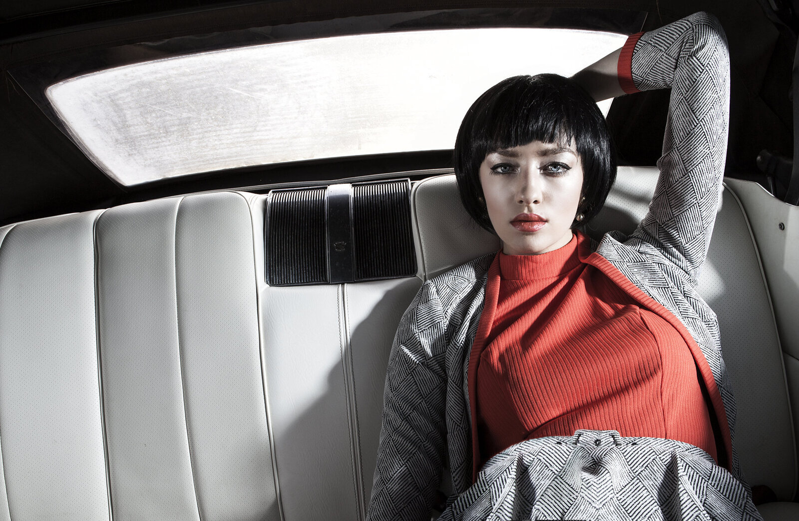 Makeup for a model in a vintage car
