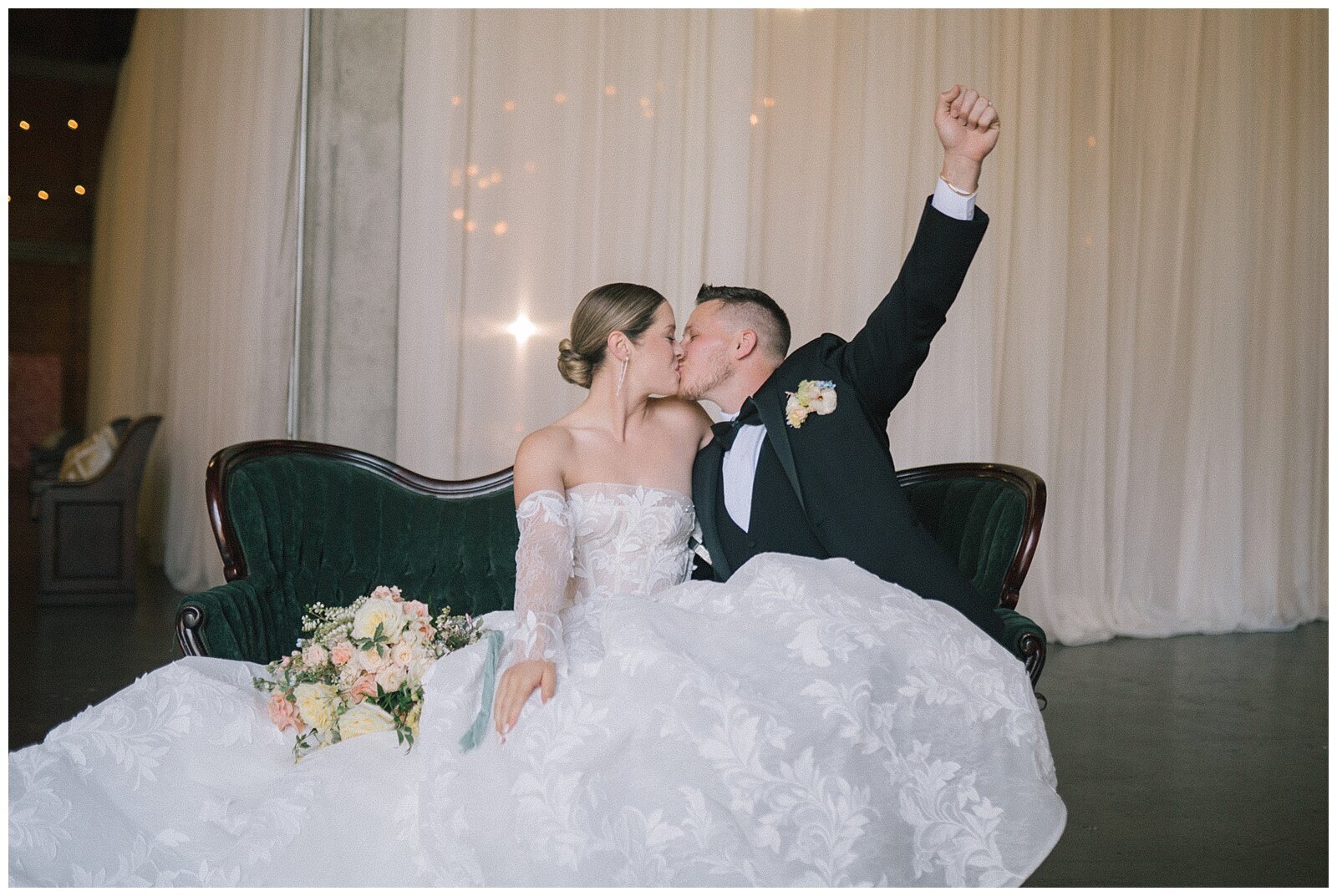 bride and groom kiss in ballroom in sacramento