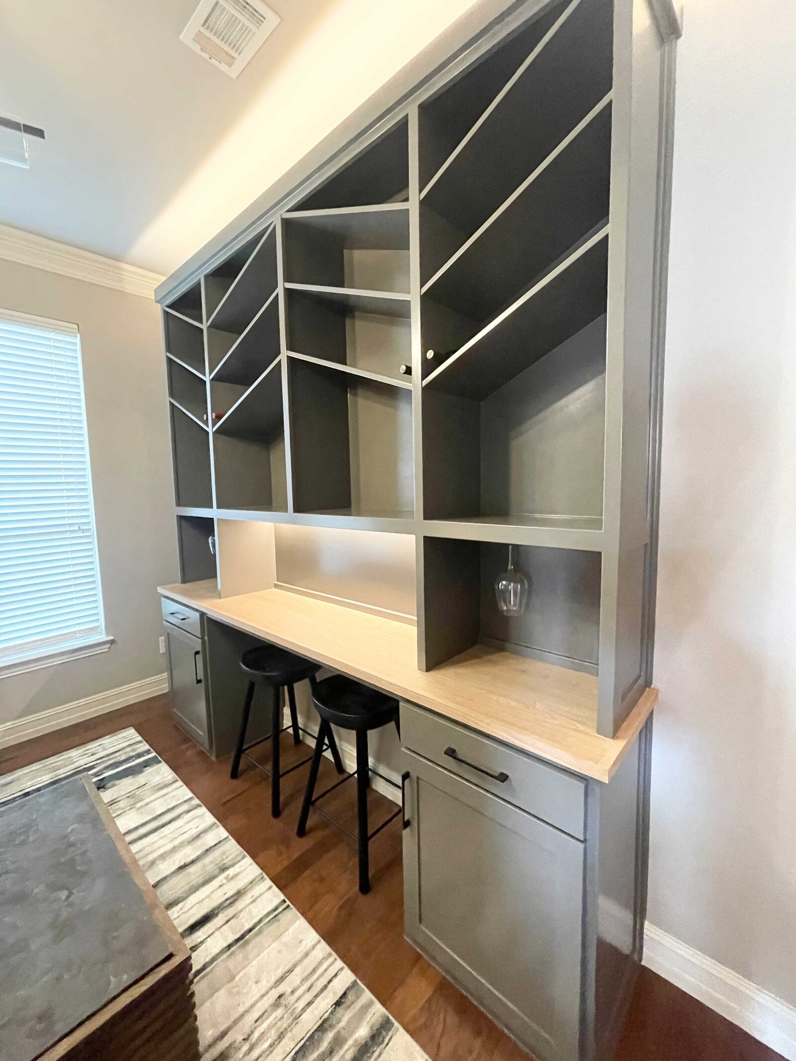 Interior home renovation designer showcasing a stylish and functional home office space, with modern furniture, organized layout, and a creative design approach that enhances productivity and comfort.