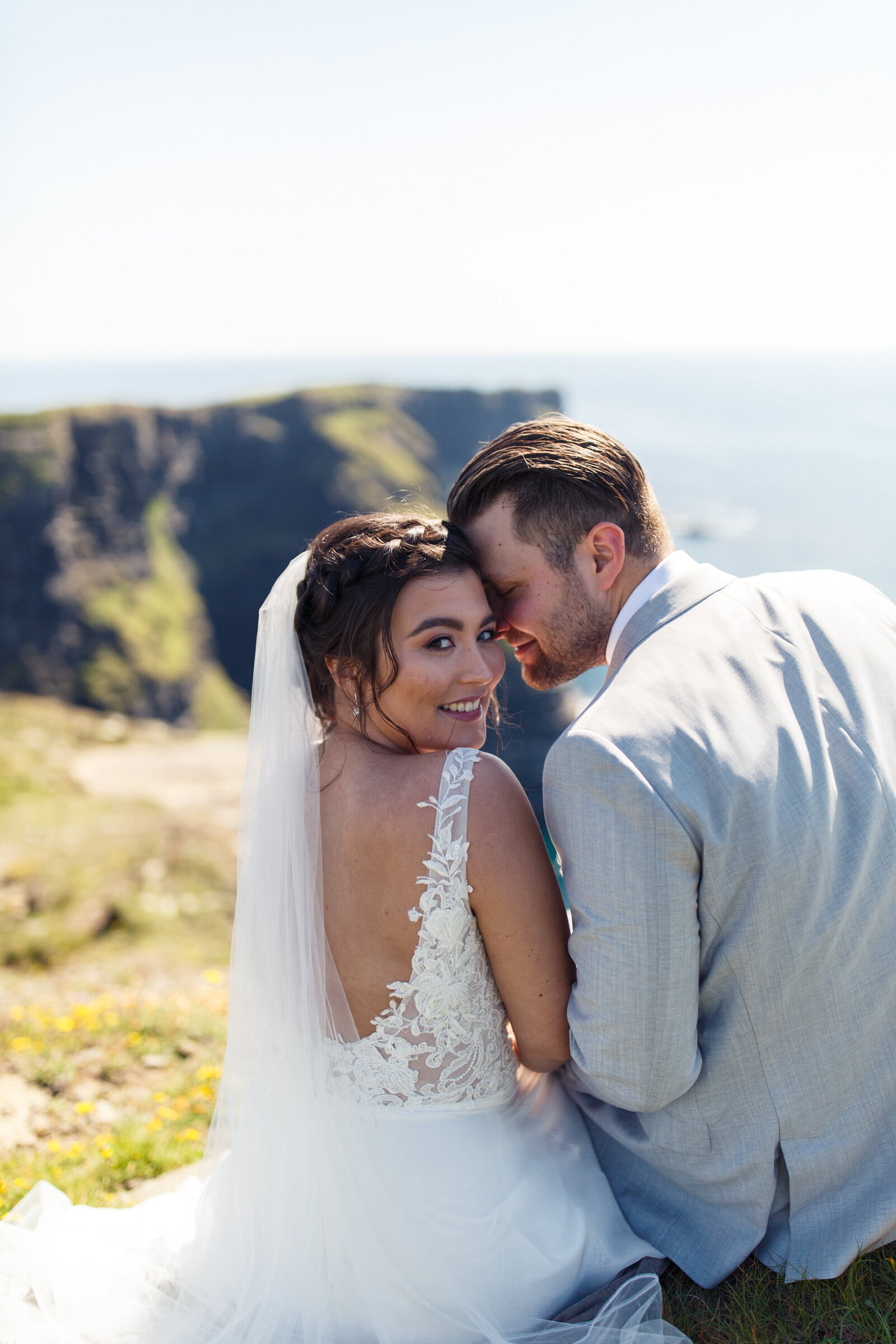 bride and groom snuggling during wedding portraits in ireland