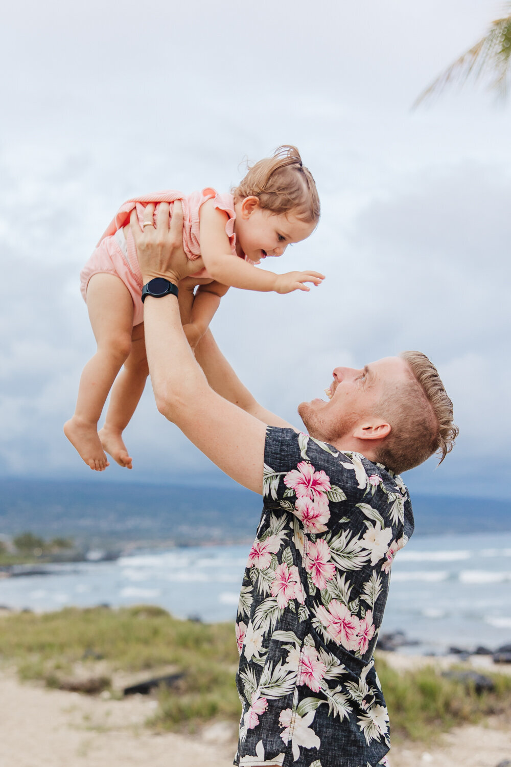 dad tossing baby in air