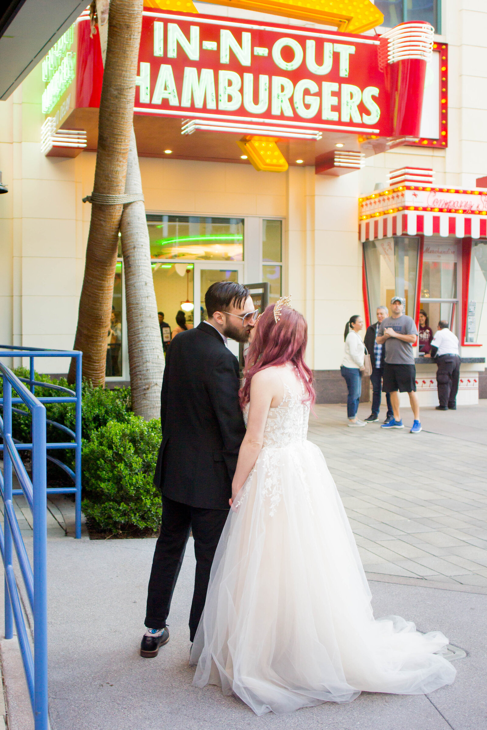 A man and woman kissing on their wedding day in Las Vegas.
