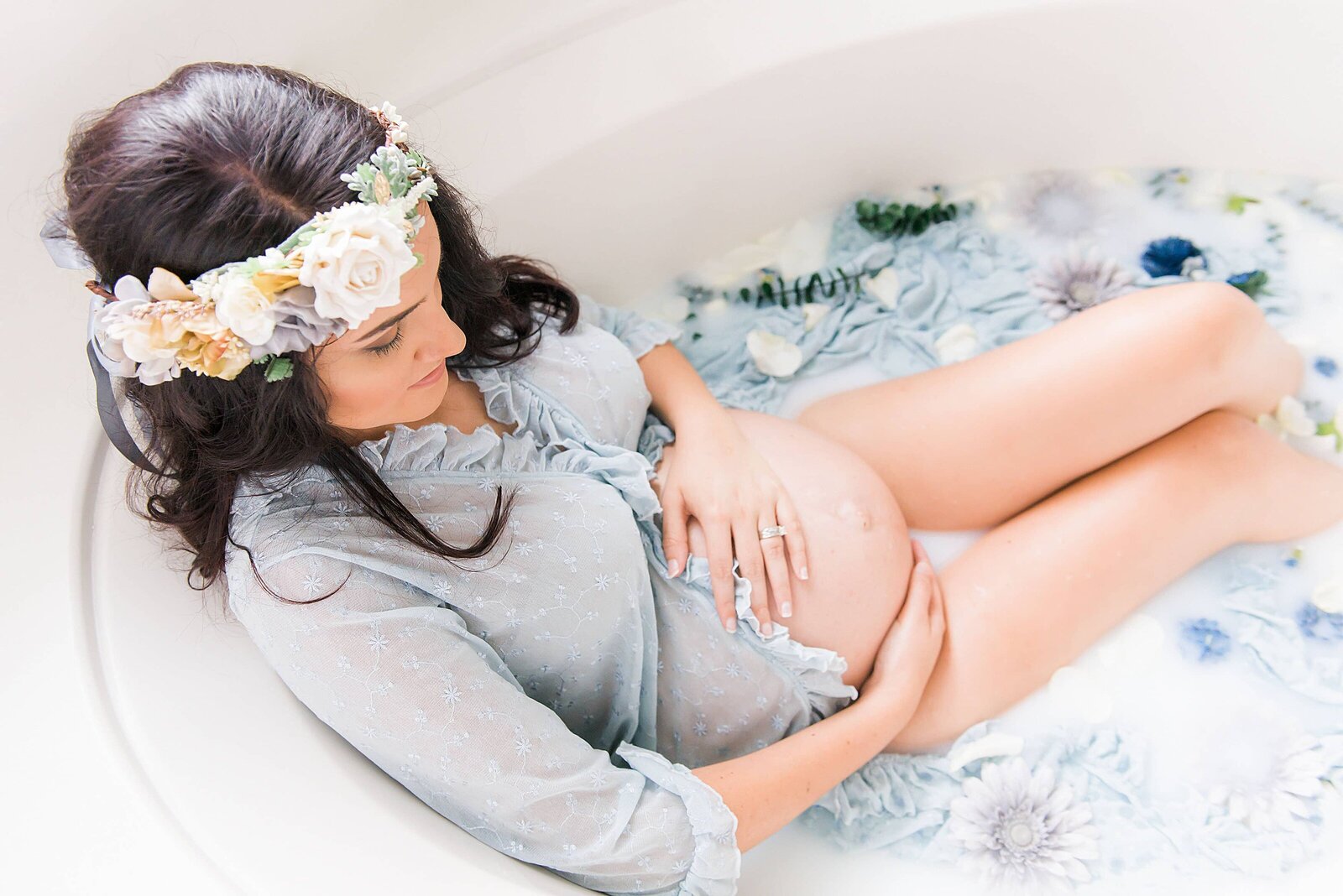 a milk bath for a pregnant woman photographed by destin maternity photographer