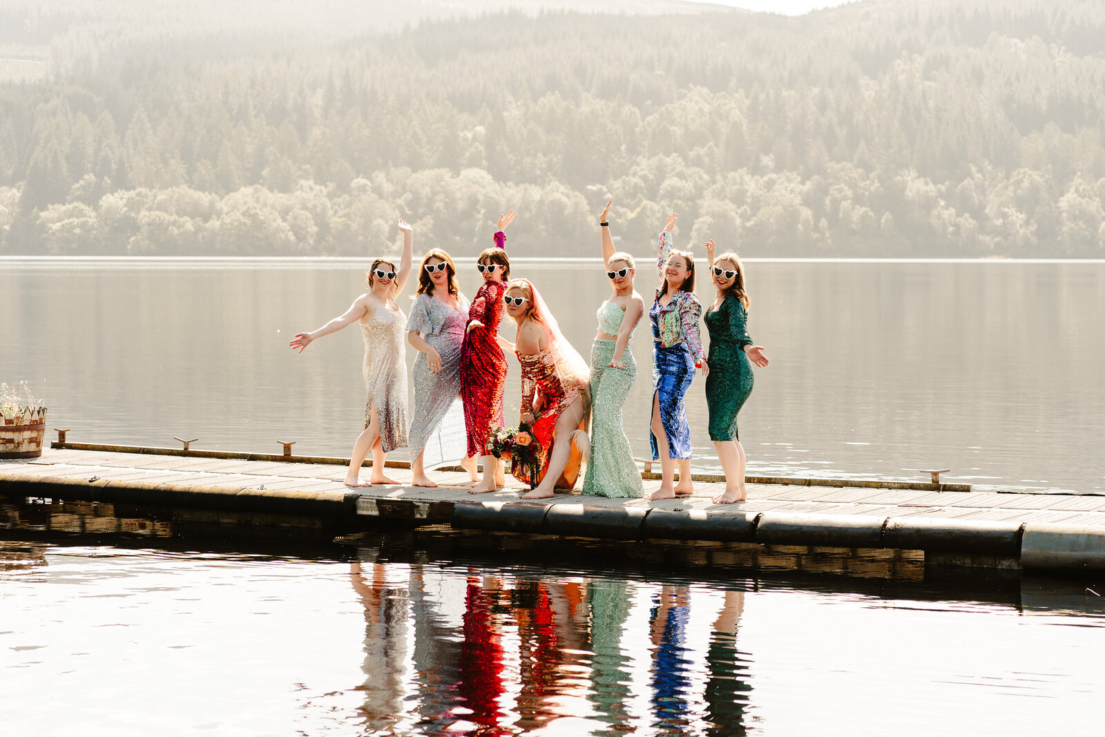 bridesmaids wearing sequin dresses posing alternative scotland wedding photographer