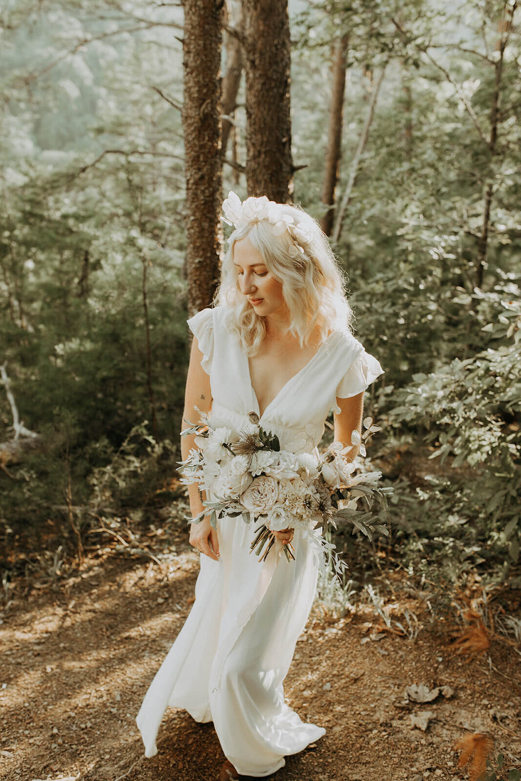 bride in simple white gown from lulus
